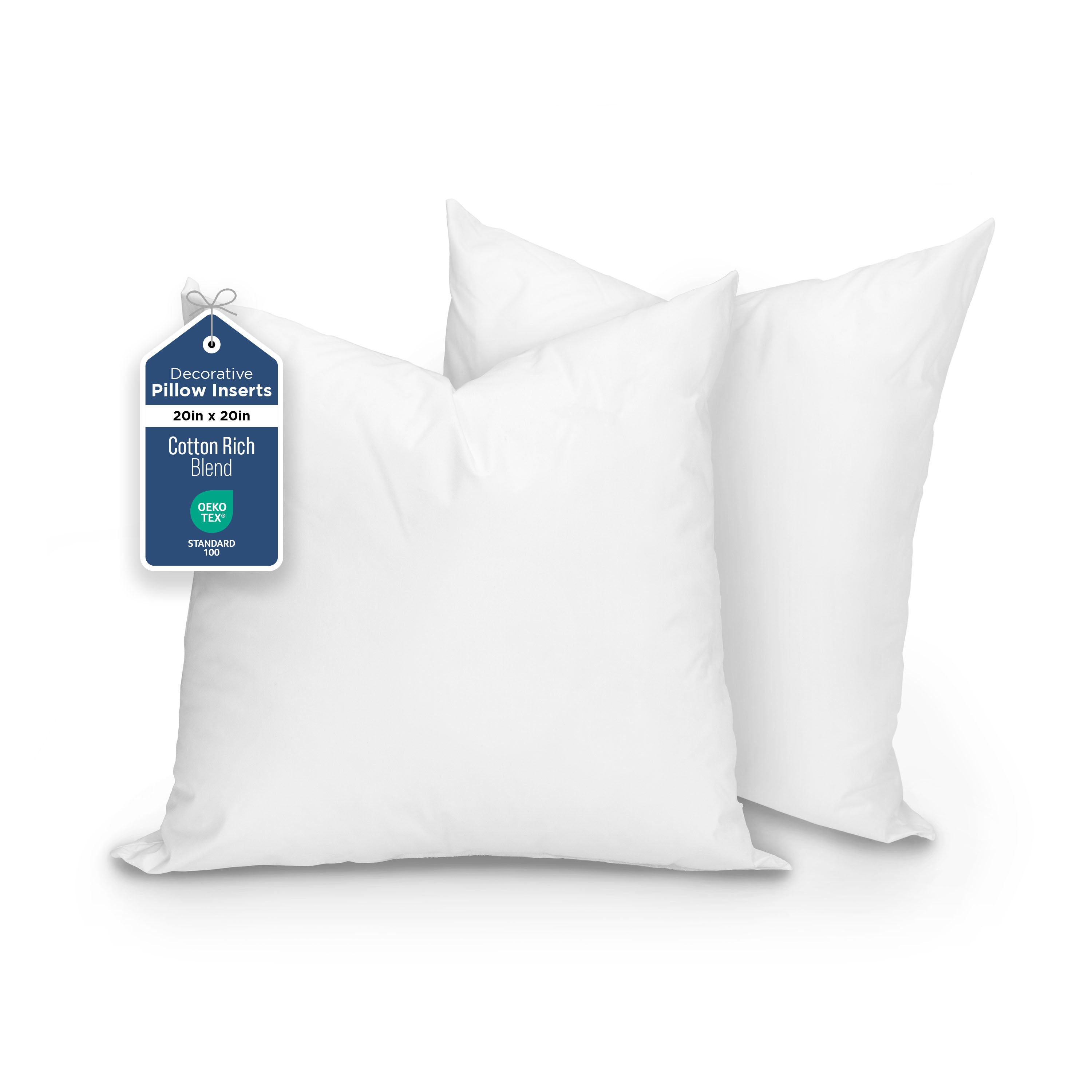 Two white decorative pillows, each measuring 20 inches by 20 inches, with a tag indicating cotton rich blend material.