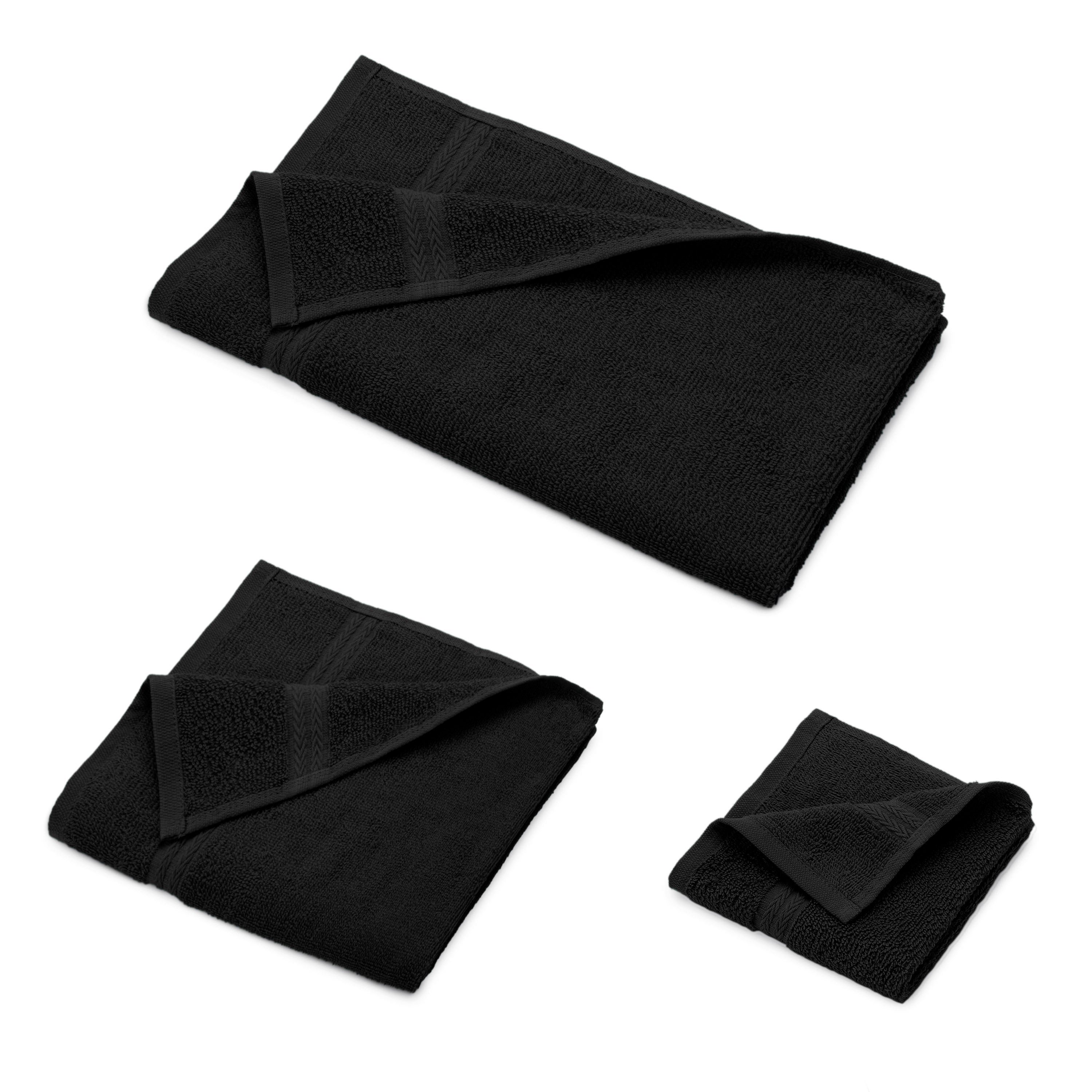 Six black towels in varying sizes, neatly folded and stacked.