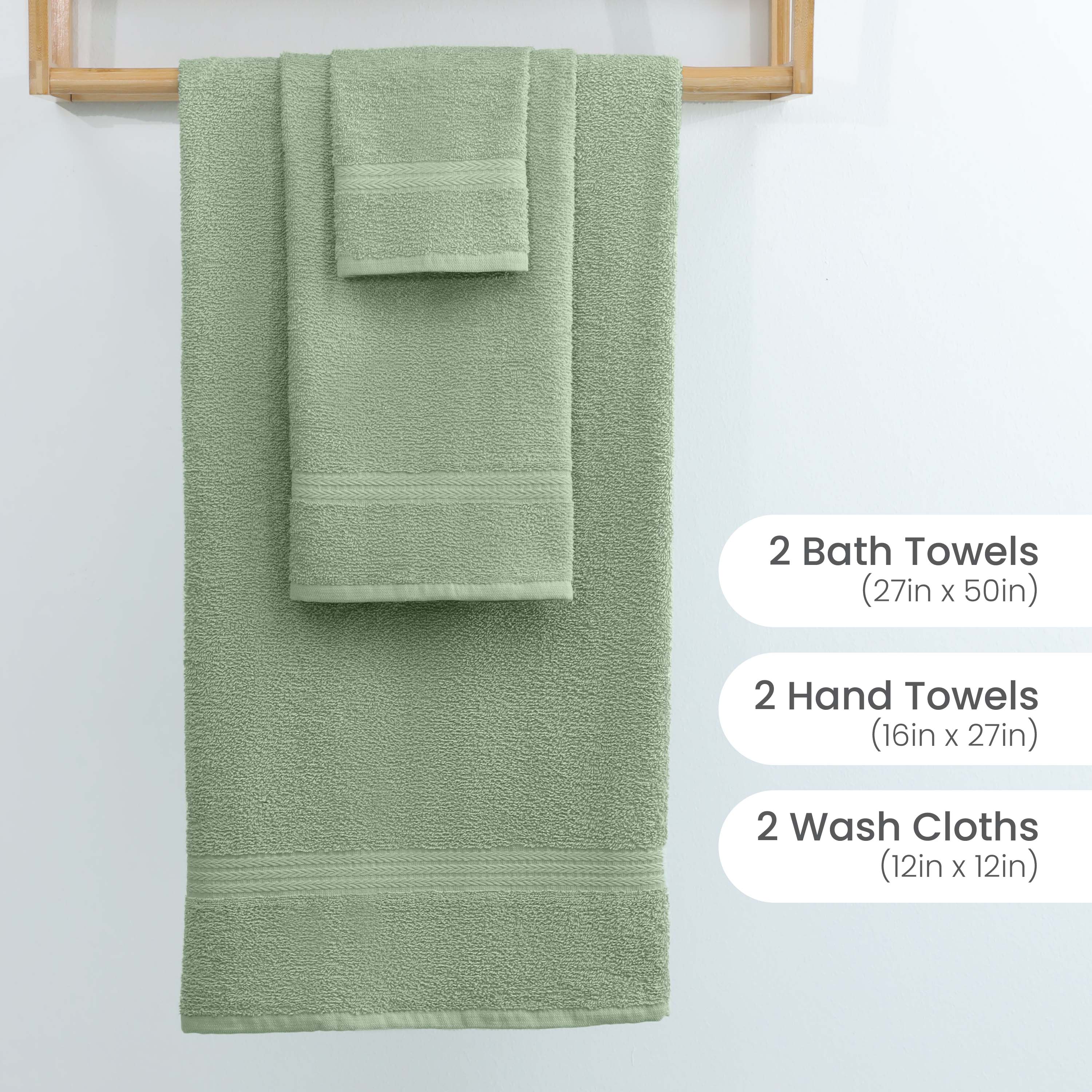 Set of six green towels including two bath towels, two hand towels, and two washcloths, displayed on a wooden rack.