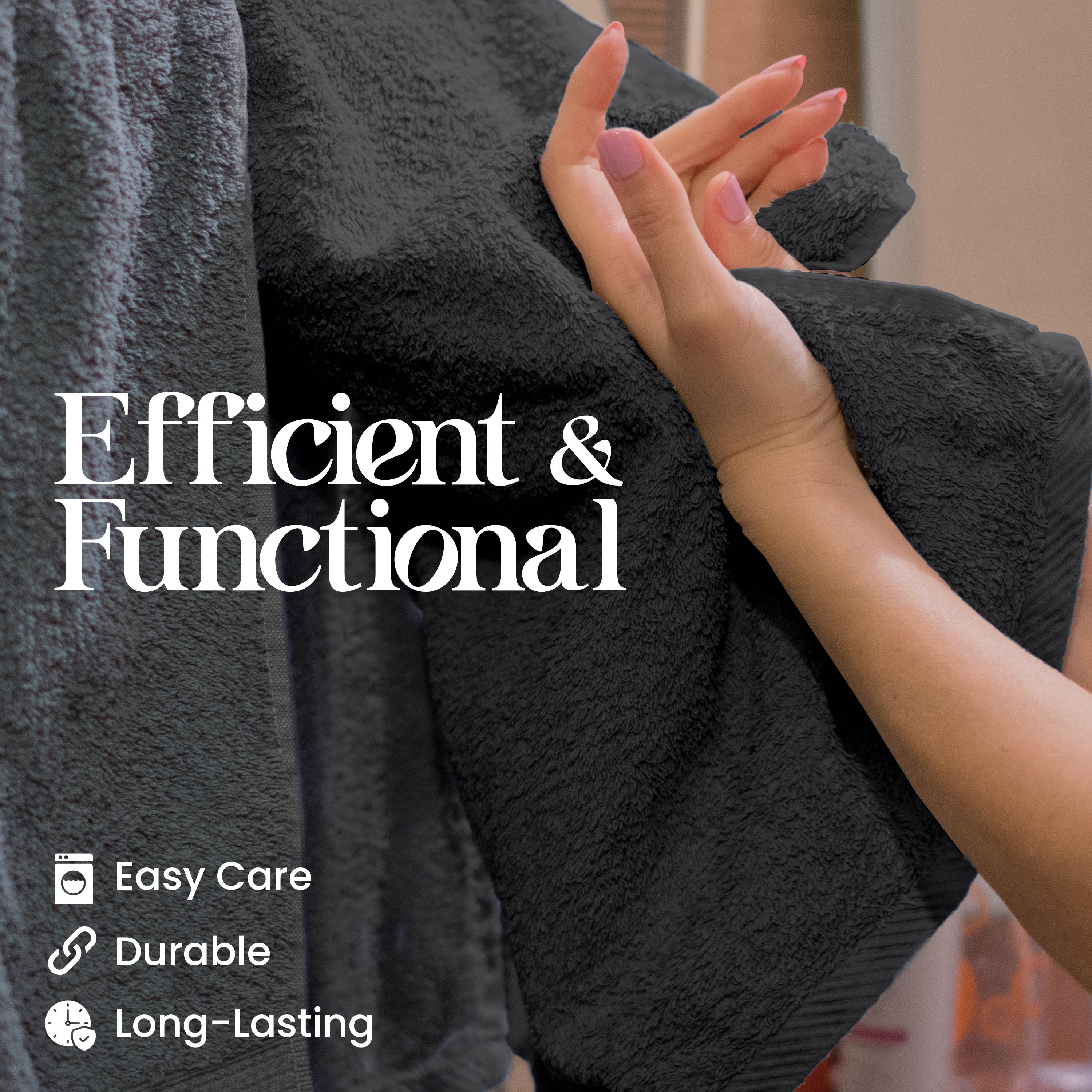 A hand holds a dark gray towel, showcasing its soft texture and quality.
