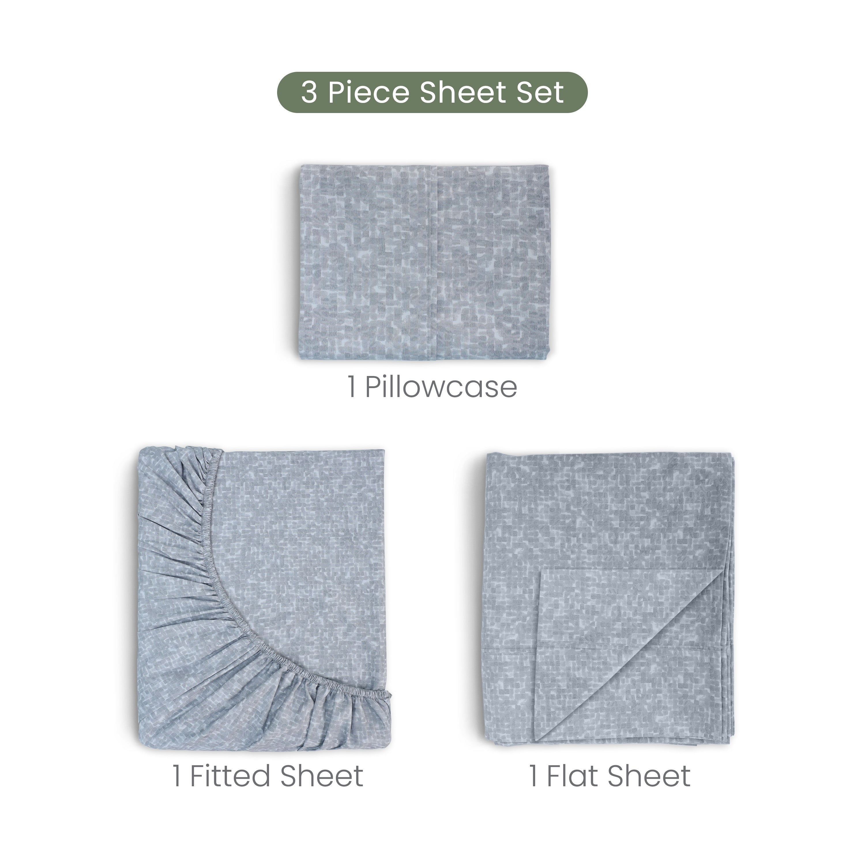Set of three folded charcoal fabric pieces on a white background