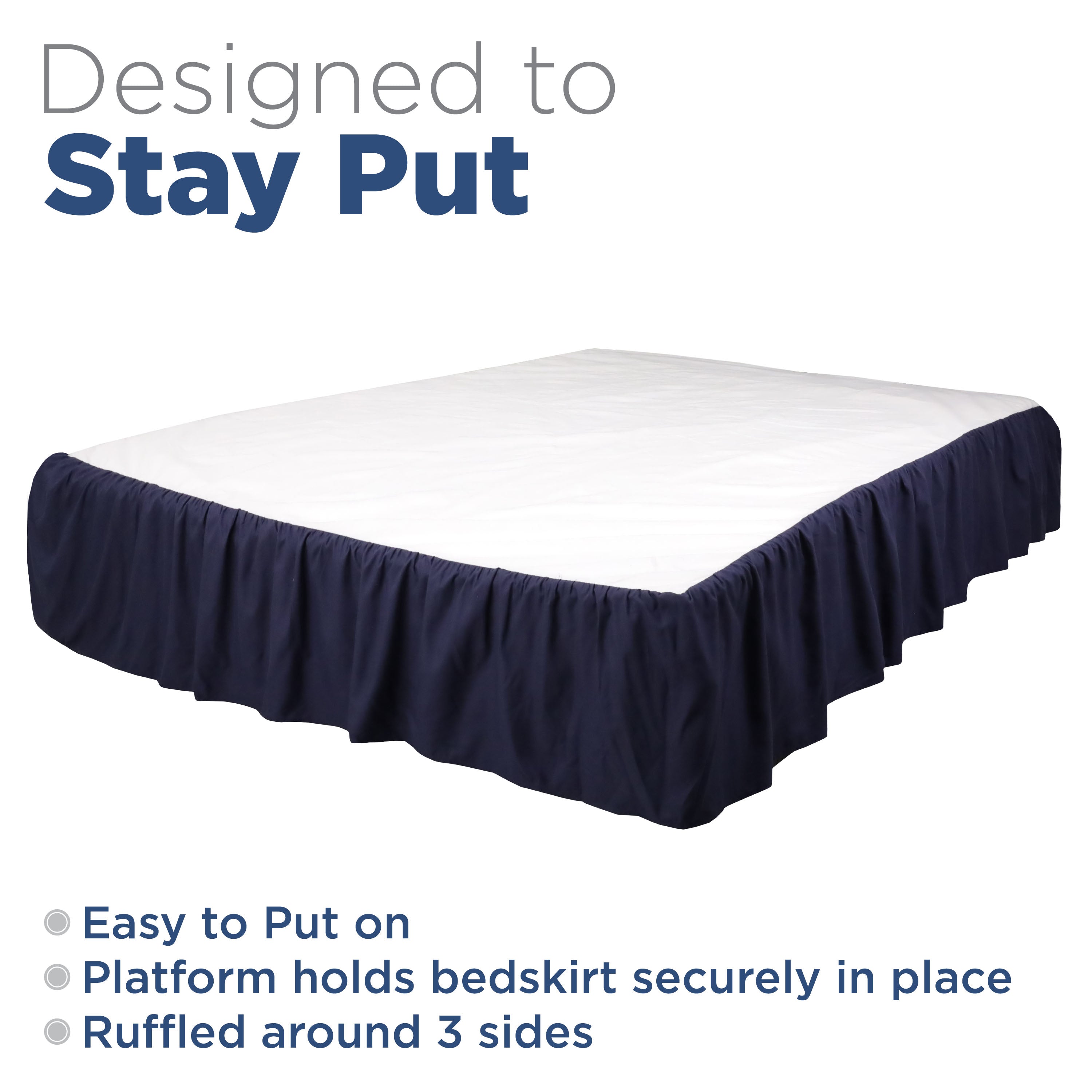 Navy ruffled bed skirt drapes around three sides of a mattress, designed to stay securely in place.