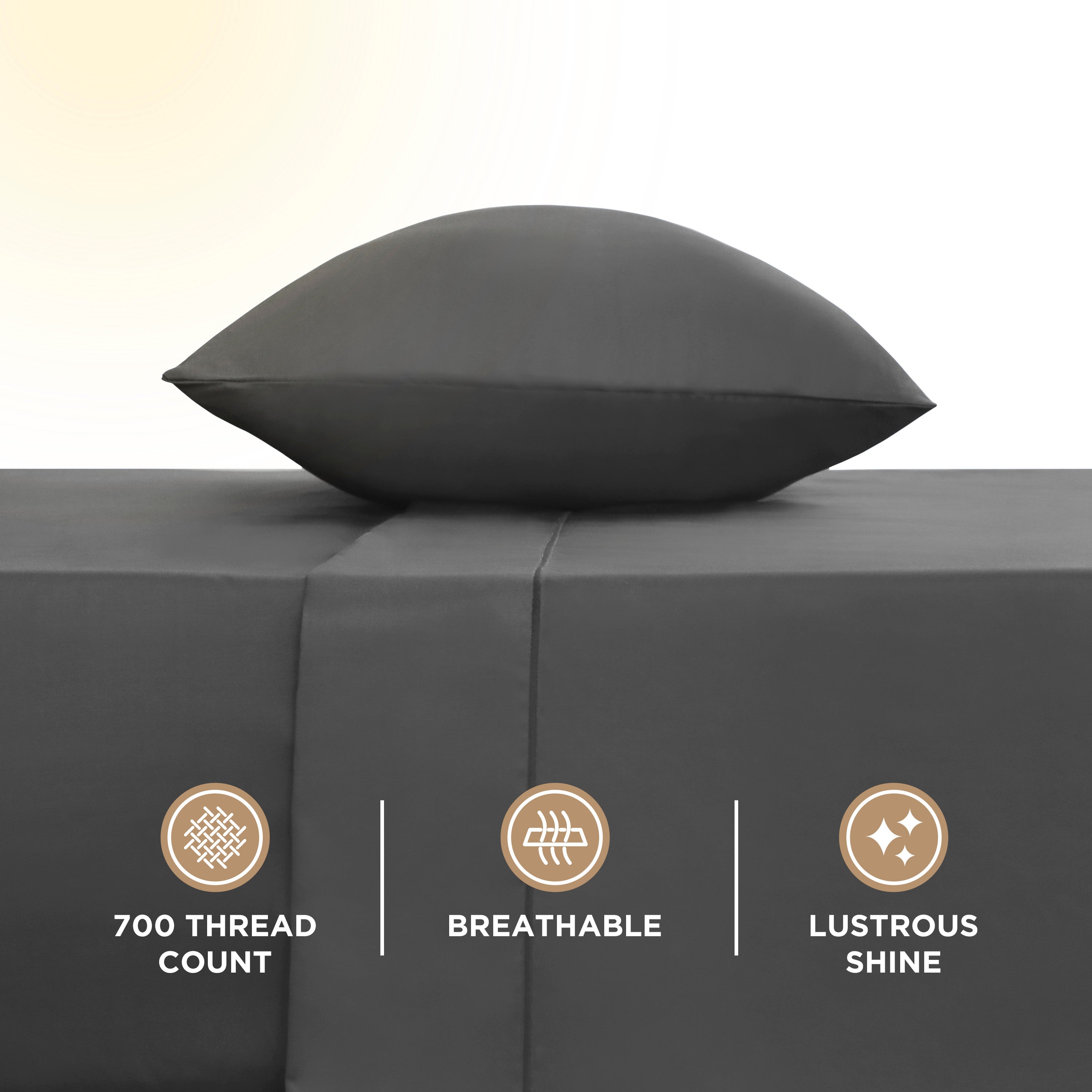 Dark gray sheet set with a matching pillow, featuring a smooth texture and highlighted thread count details.