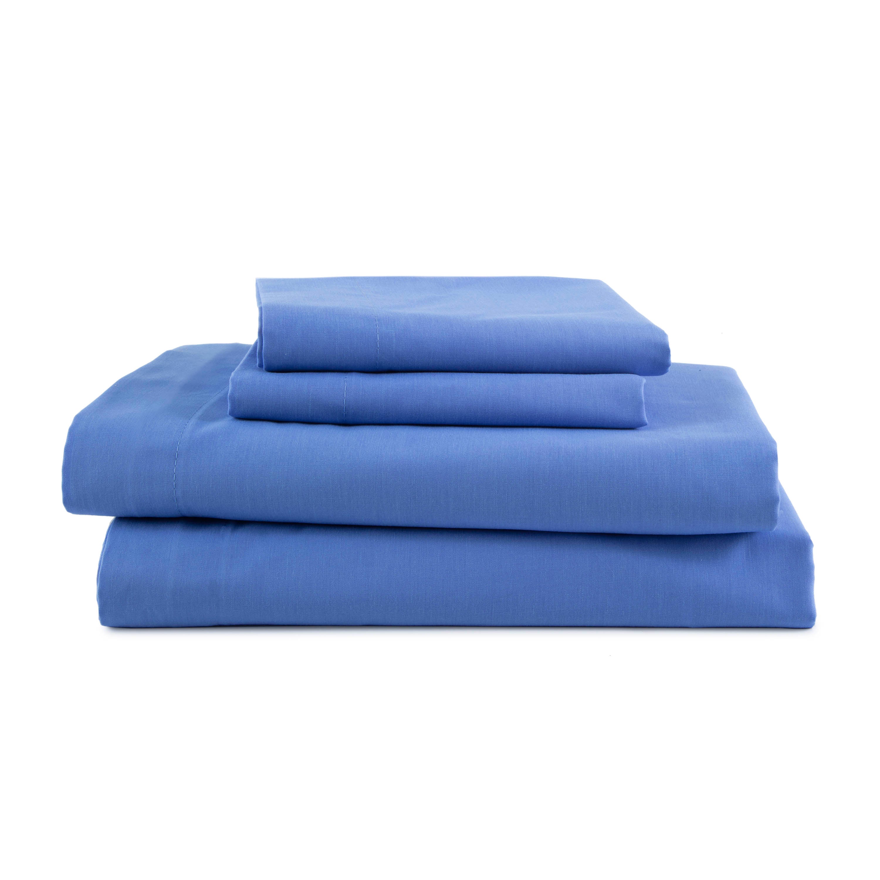 Four pieces of blue sheets stacked neatly, including fitted and flat sheets with pillowcases.