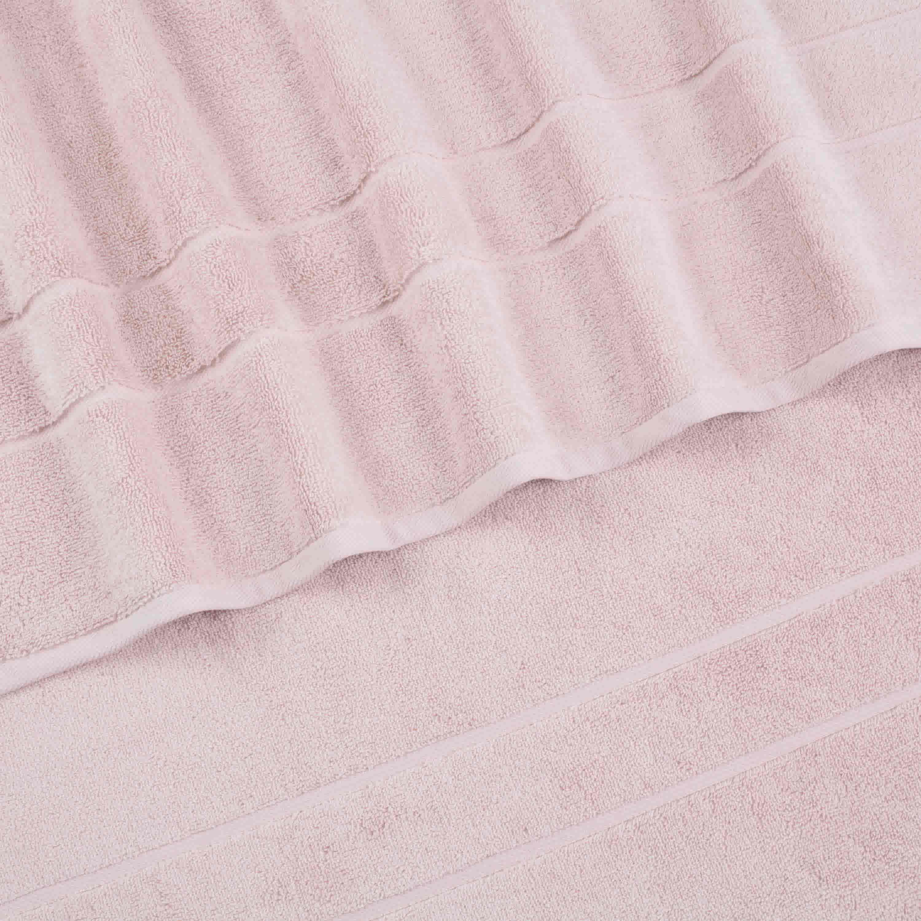 Two soft pink hand towels with textured stripes and a smooth border.