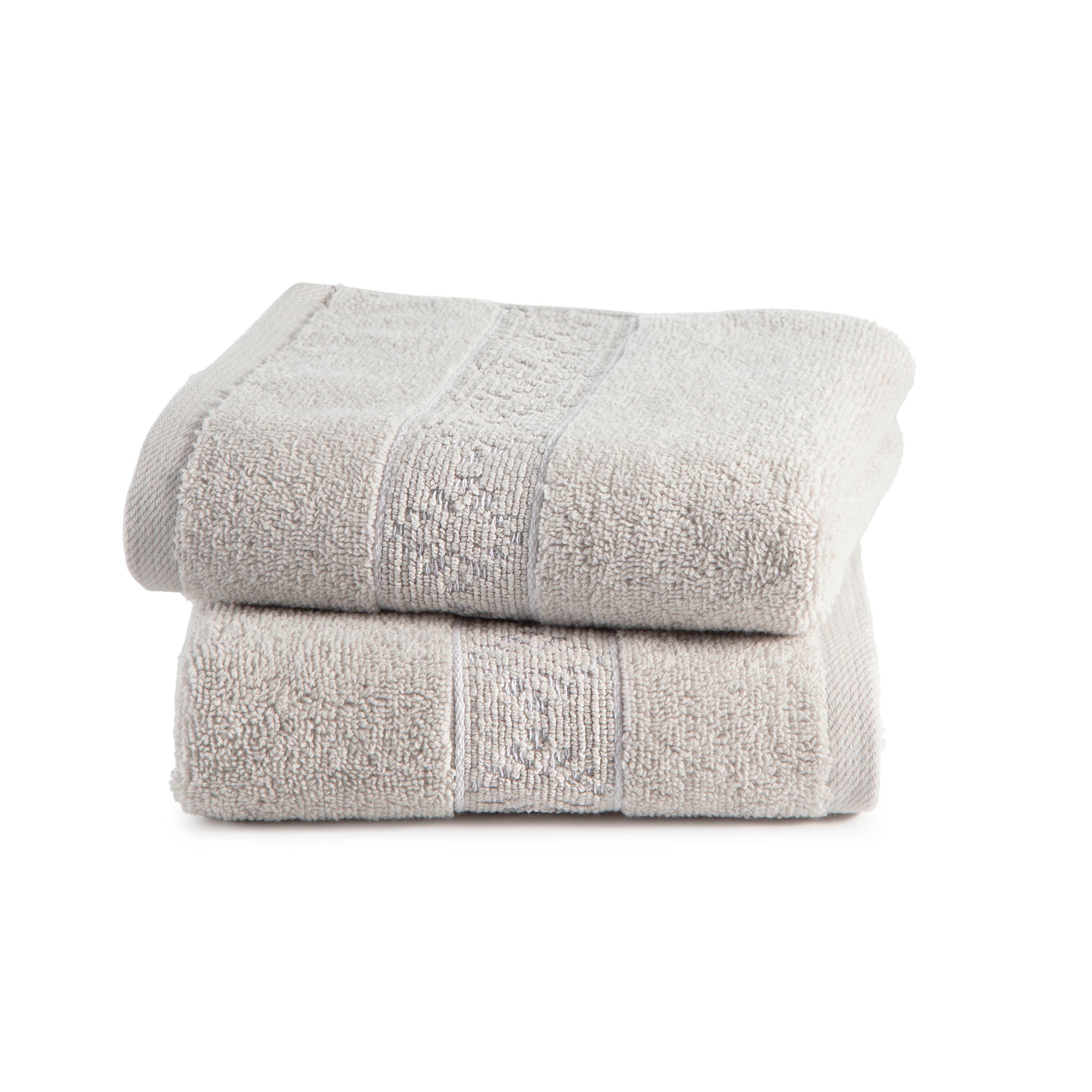 Two stacked towels in a light gray color with textured detailing.