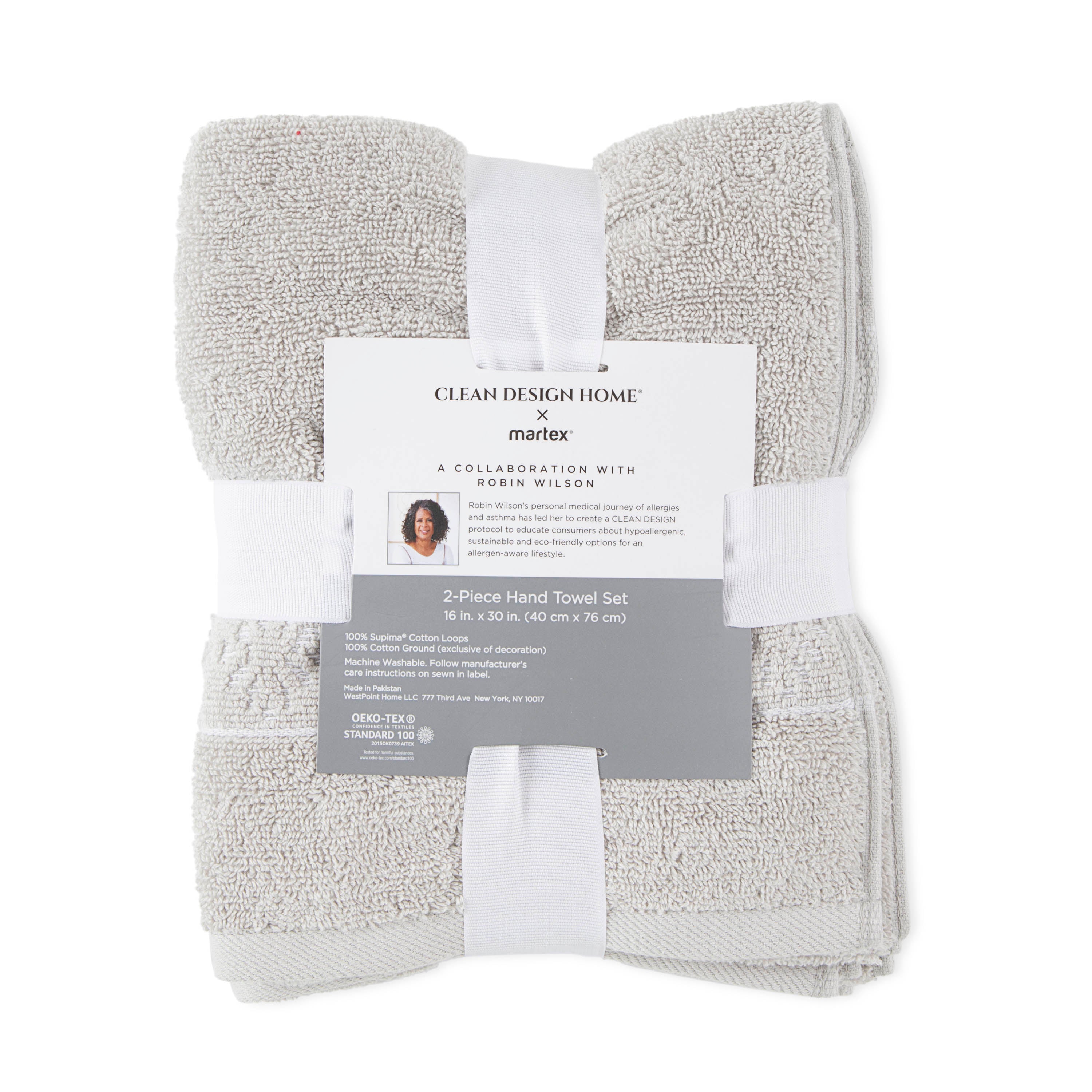 Two-piece hand towel set in light gray, featuring a decorative band and a label with care instructions.