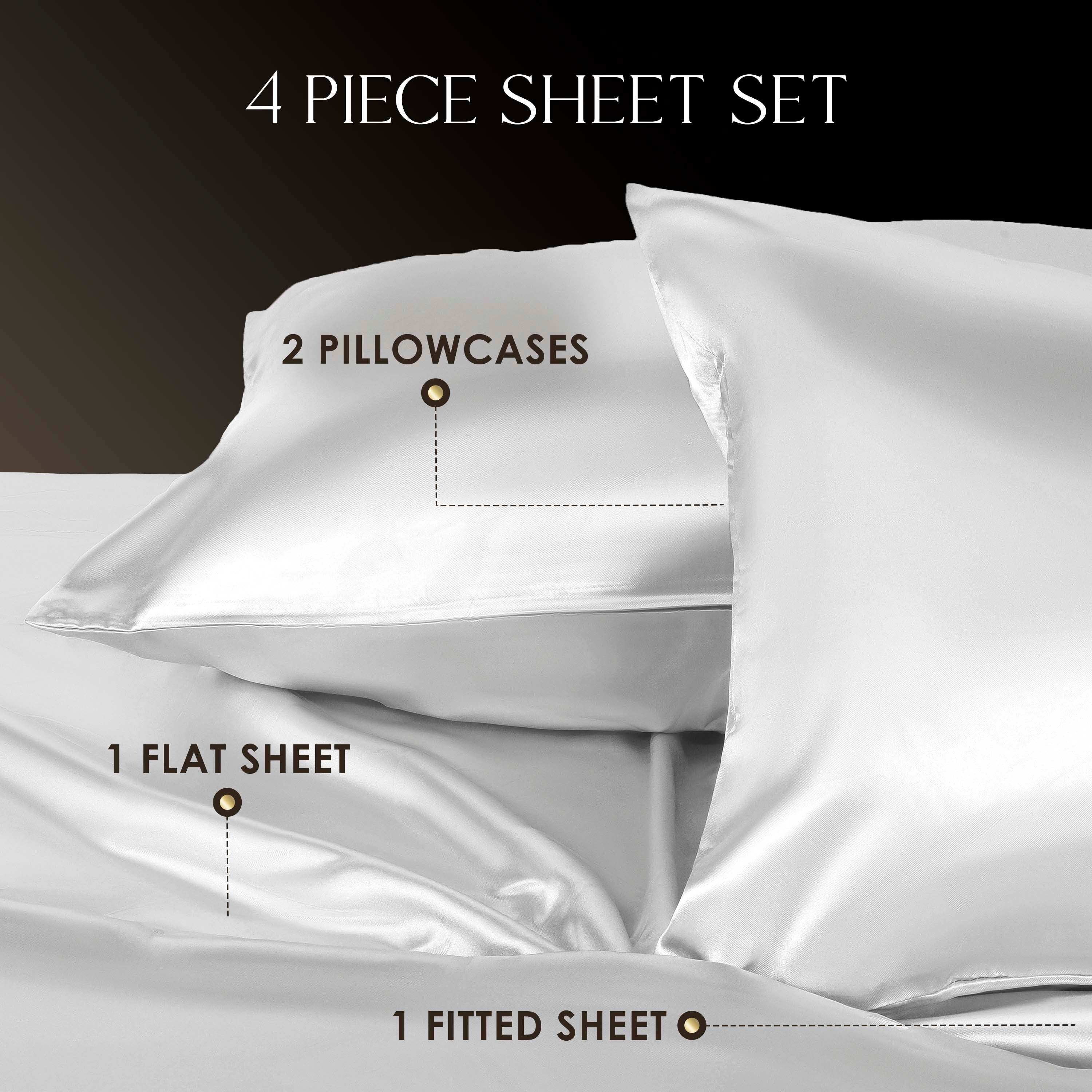 Four-piece satin sheet set including two pillowcases, one flat sheet, and one fitted sheet.