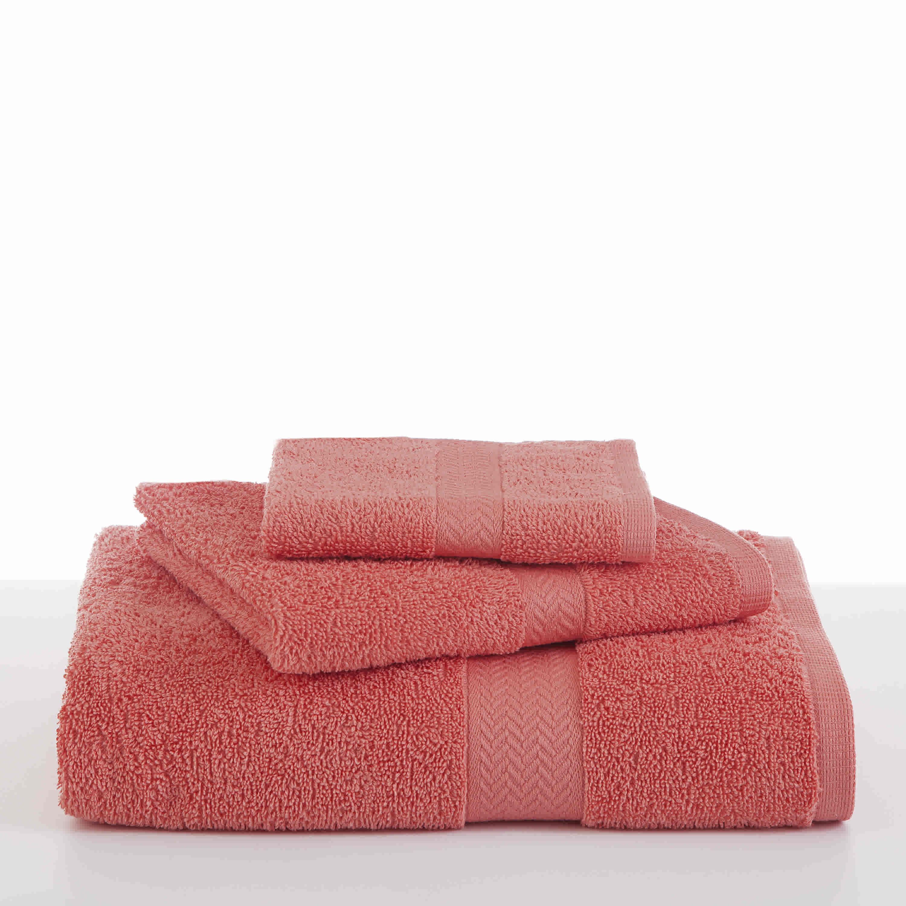Three stacked towels in a coral color, featuring textured fabric and decorative bands.