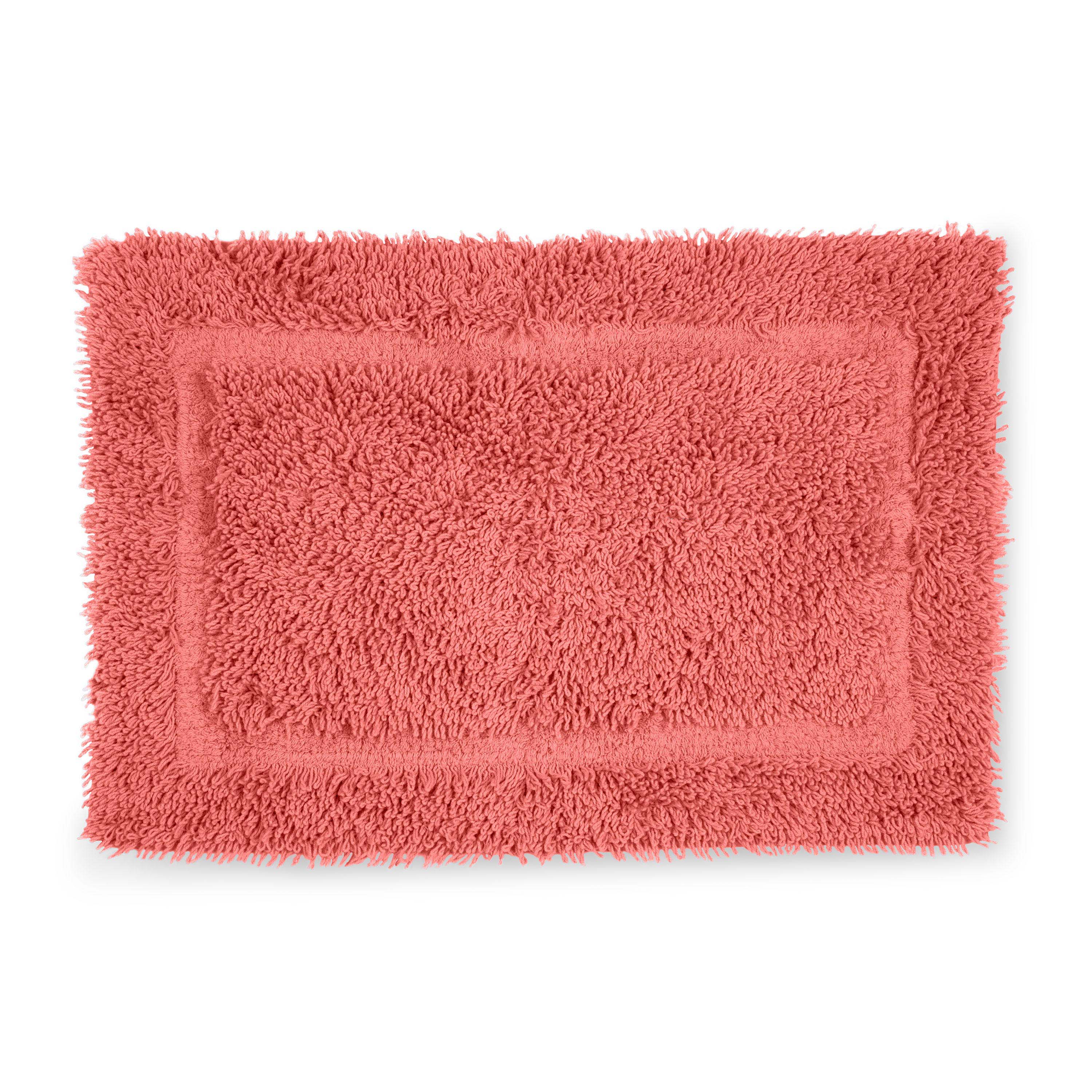 Rectangular bath rug in coral color with a textured, fluffy surface and a bordered design.