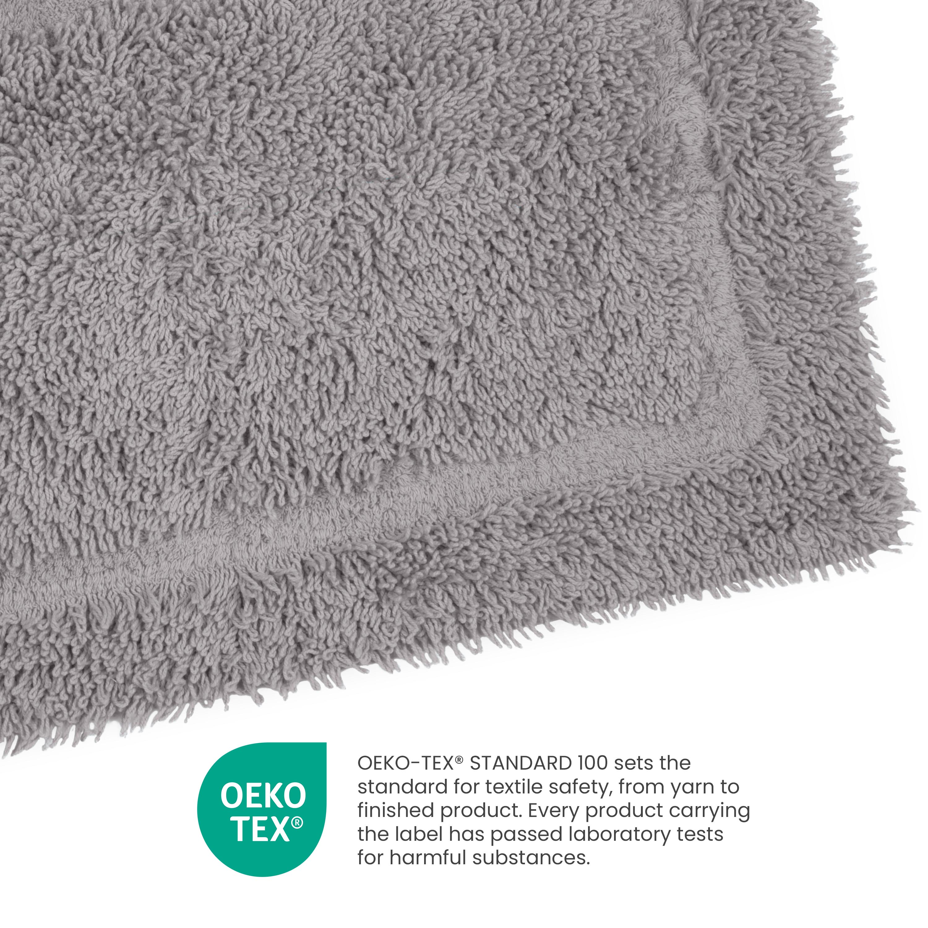 Gray ringspun cotton bath rug with a plush texture and bordered edge.