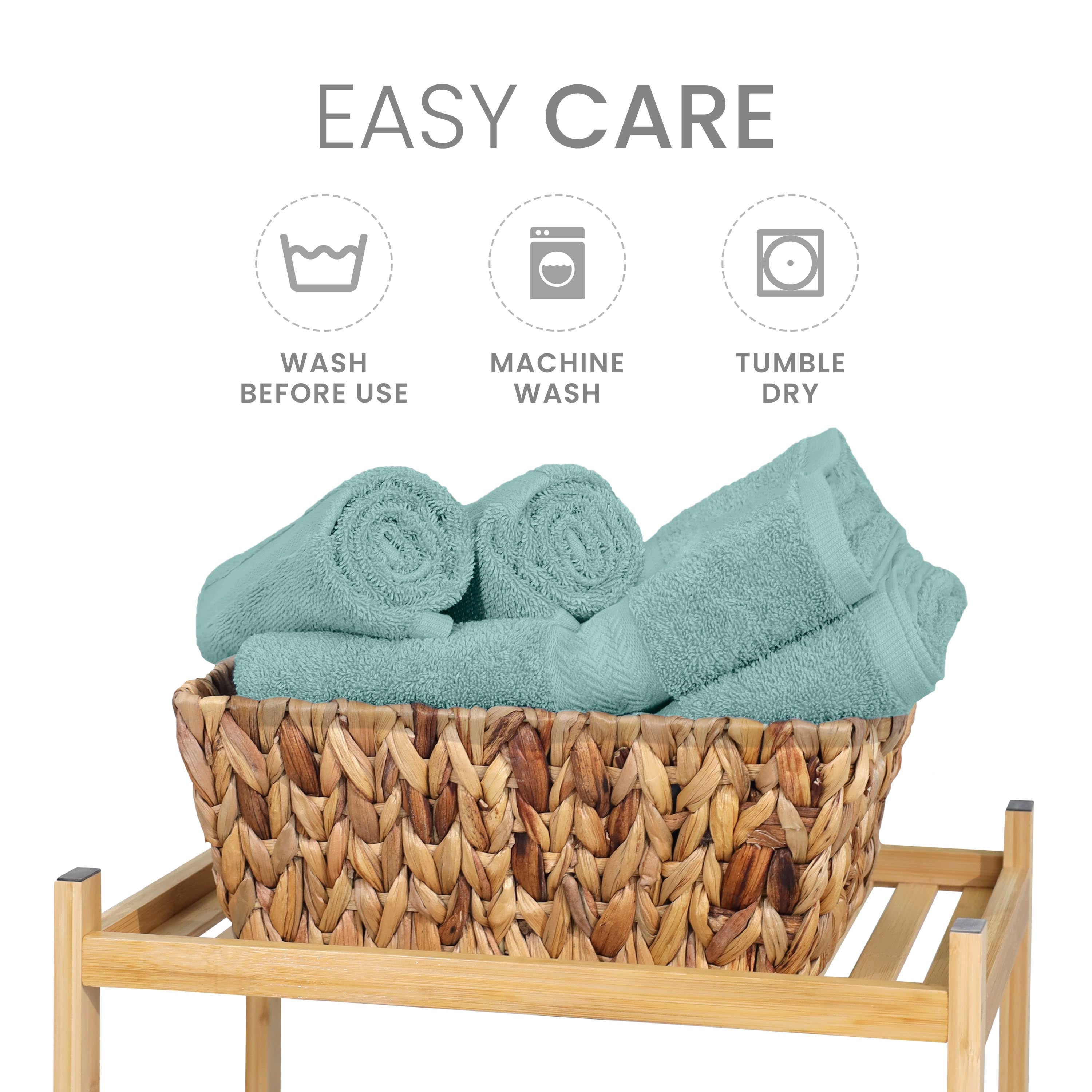 Six rolled towels in a woven basket on a wooden stand, with care instructions displayed above.