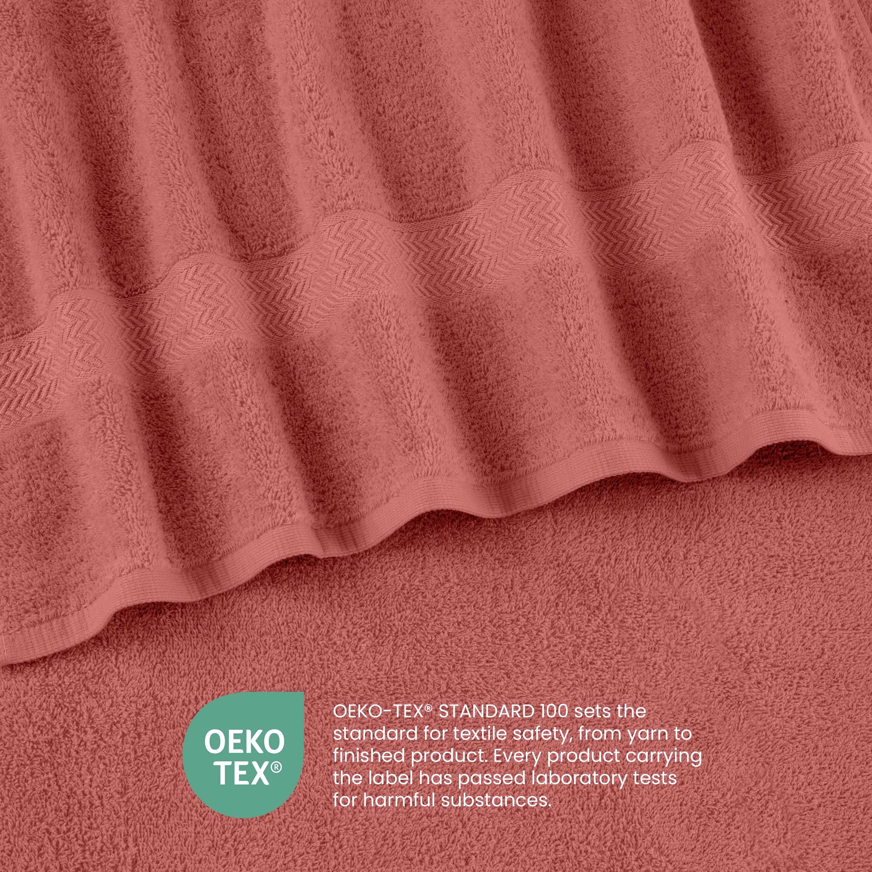 Soft coral towels with a textured stripe design and Oeko-Tex certification for textile safety.