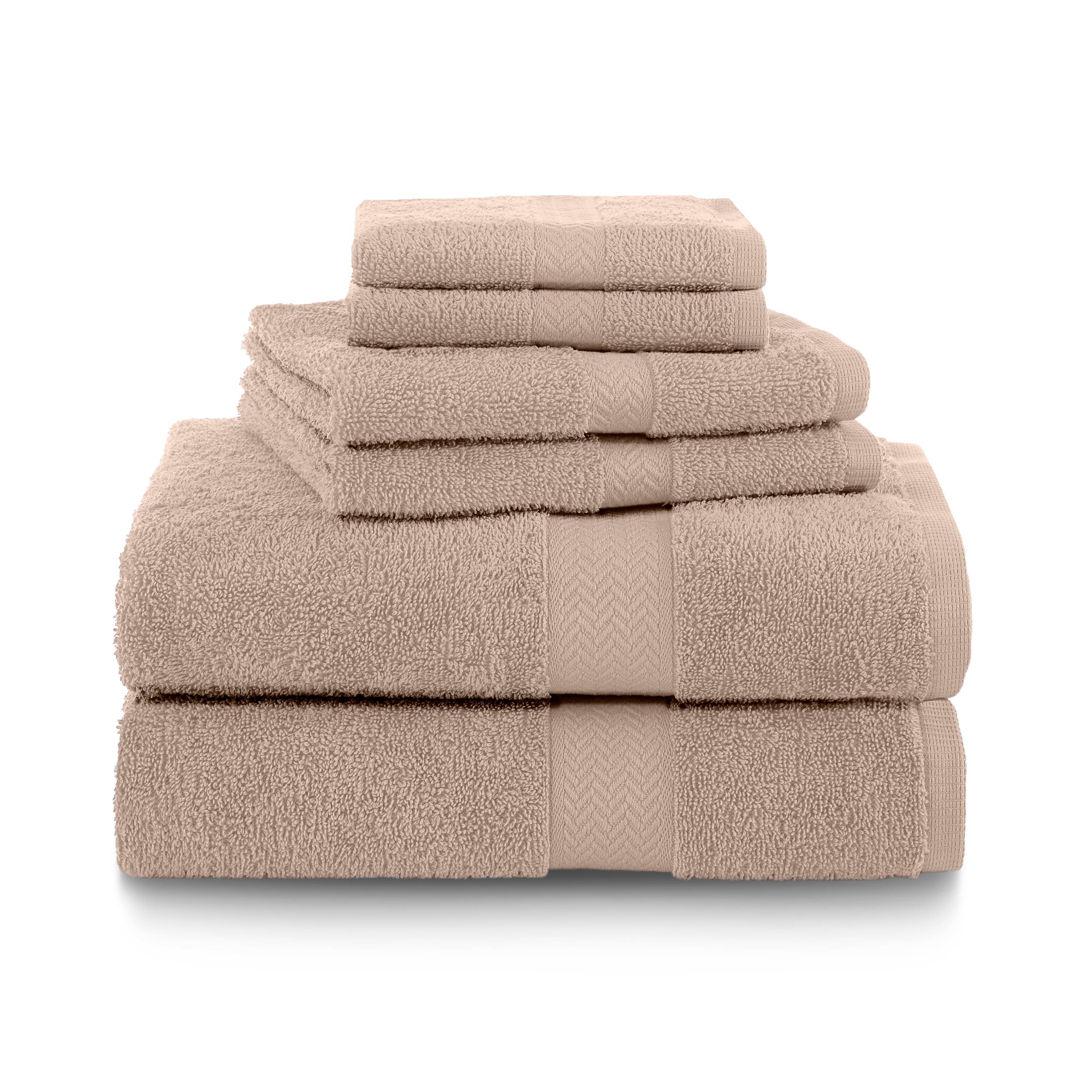 Set of six beige towels stacked in varying sizes, featuring a textured border design.