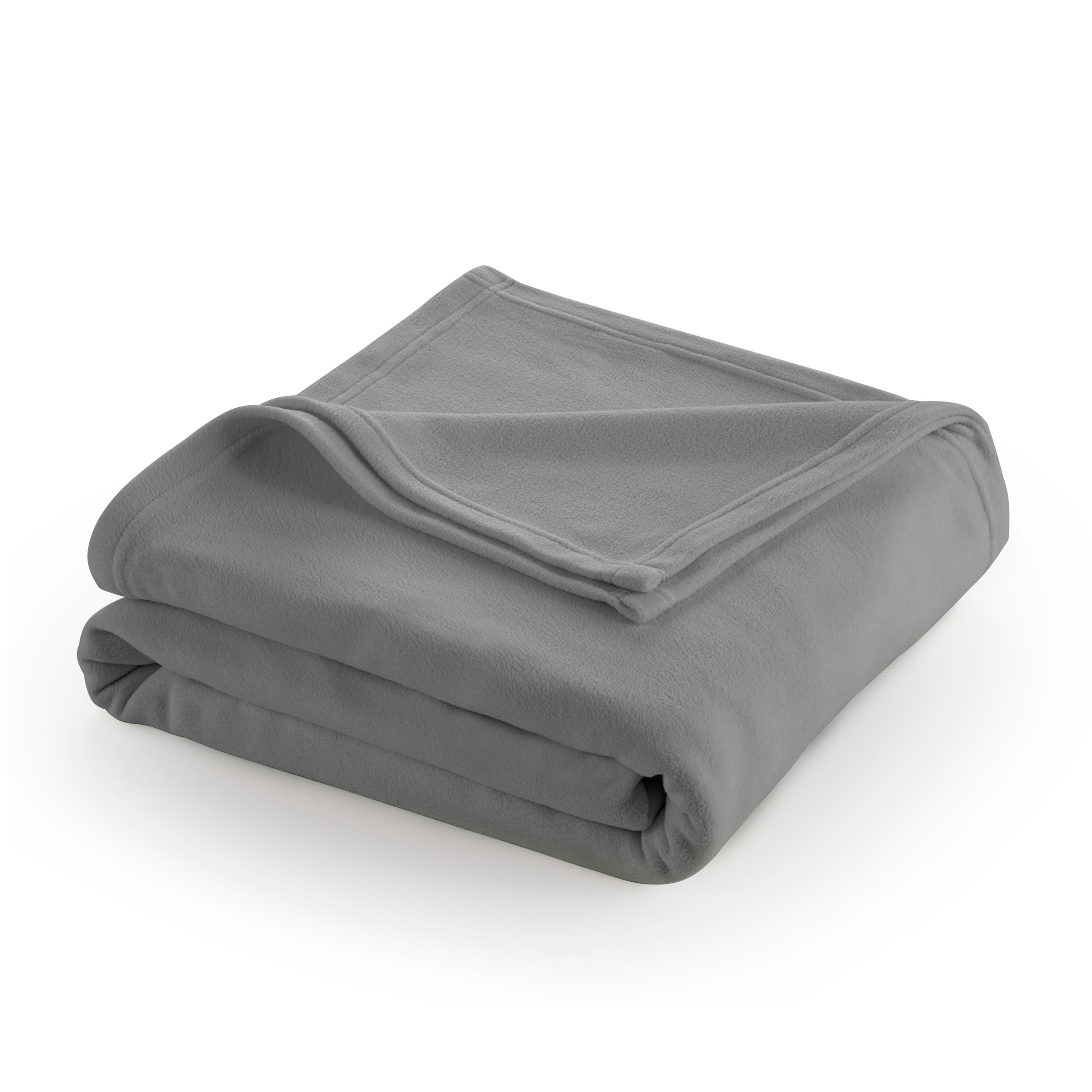 Gray fleece blanket neatly folded with a corner slightly turned down.