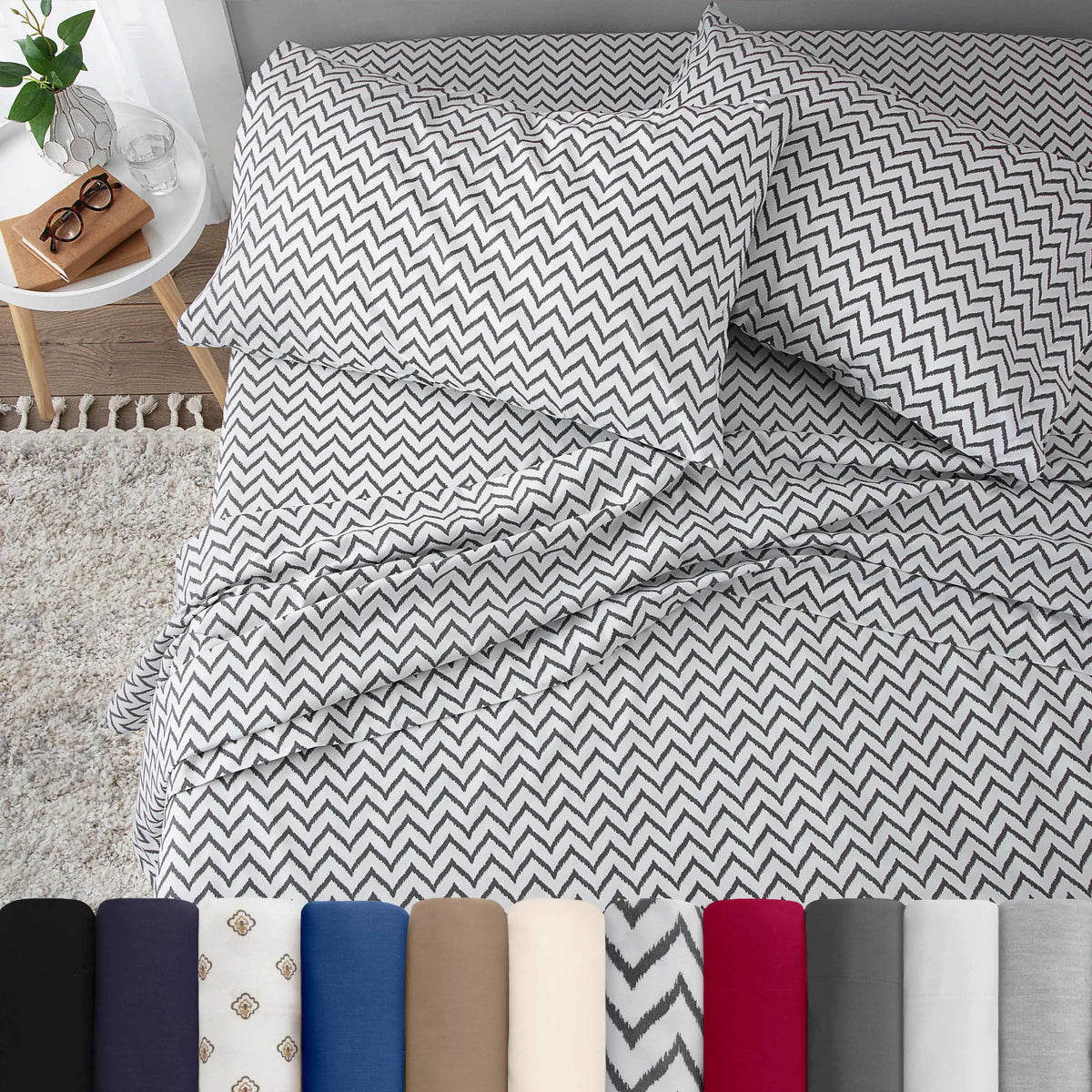Neatly made bed with chevron white bedding in a bedroom setting.