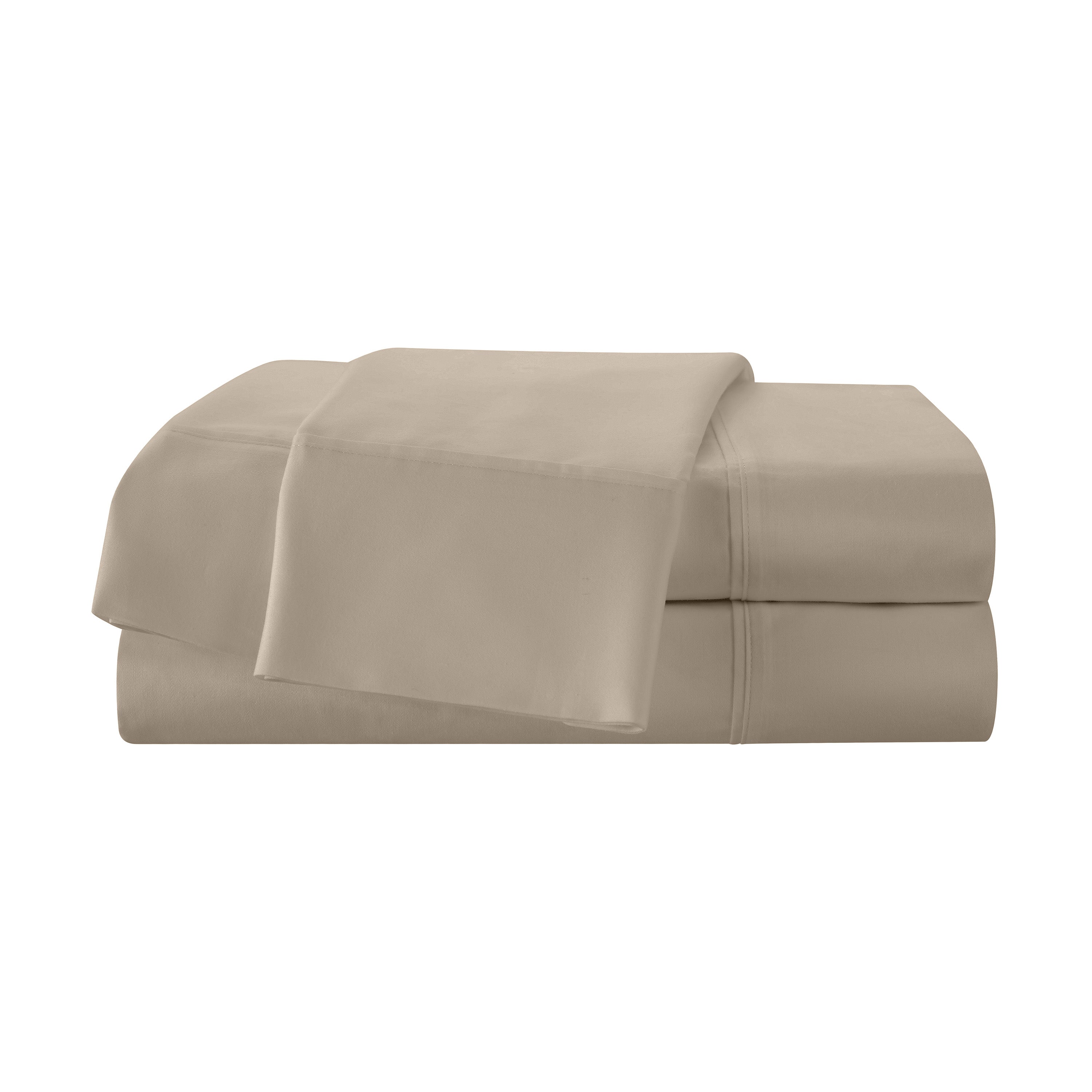 Beige cotton sheet set stacked neatly with a top sheet partially draped over the fitted sheet.