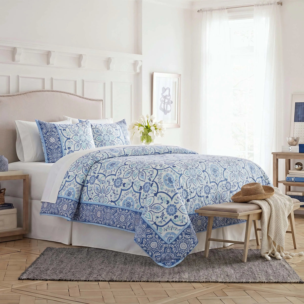 Side view image of the comforter set on a bed