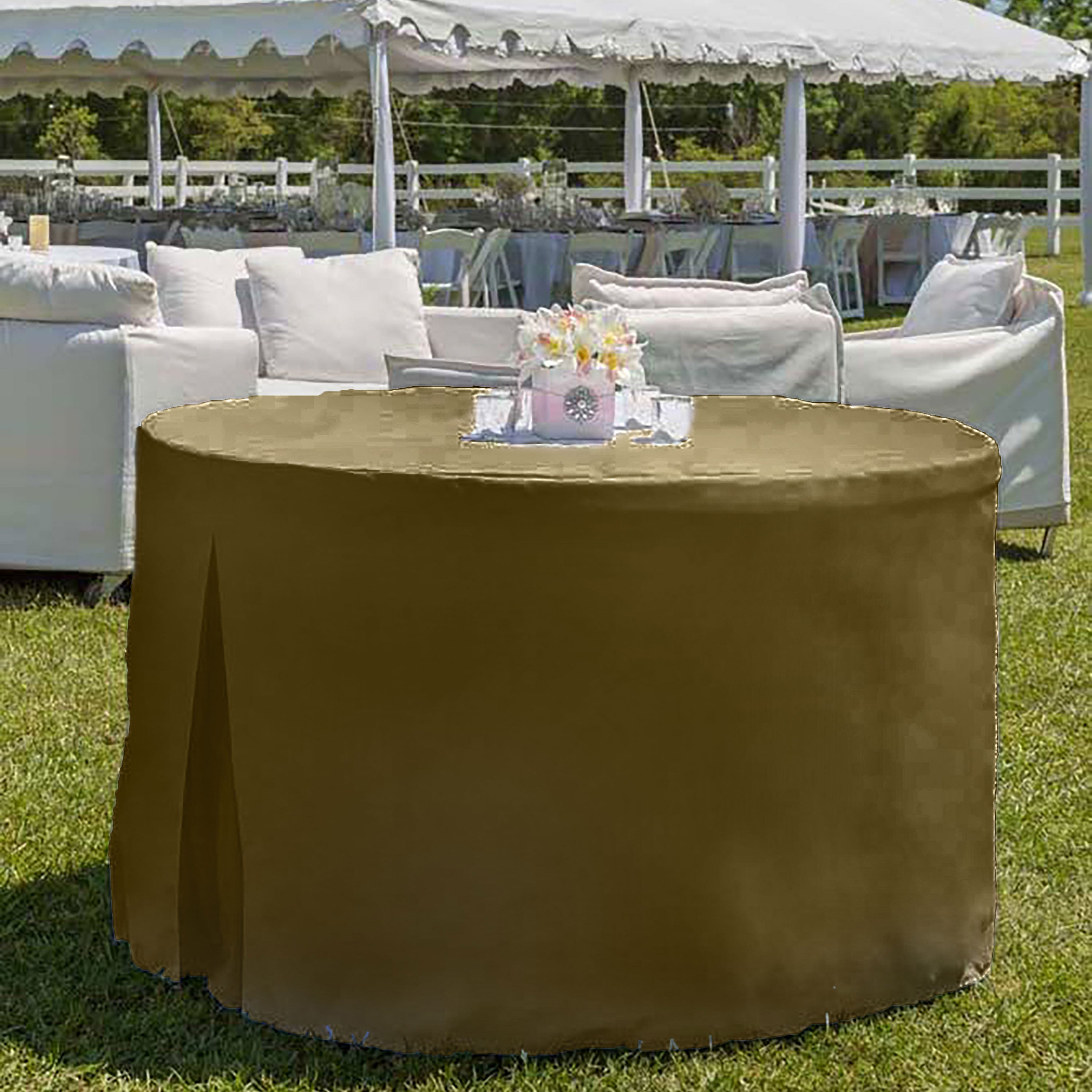 Round table covered with a solid brown table cover, set outdoors with a floral centerpiece.