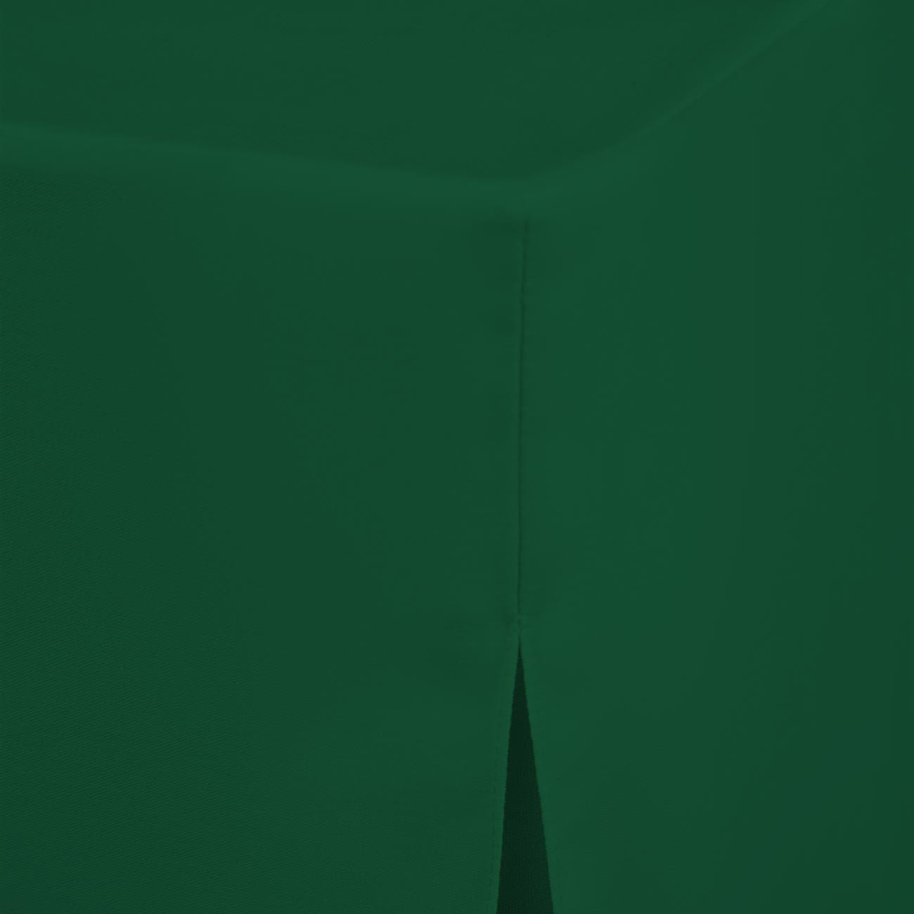 Green round table cover with a seam and a slight drape at the edge.