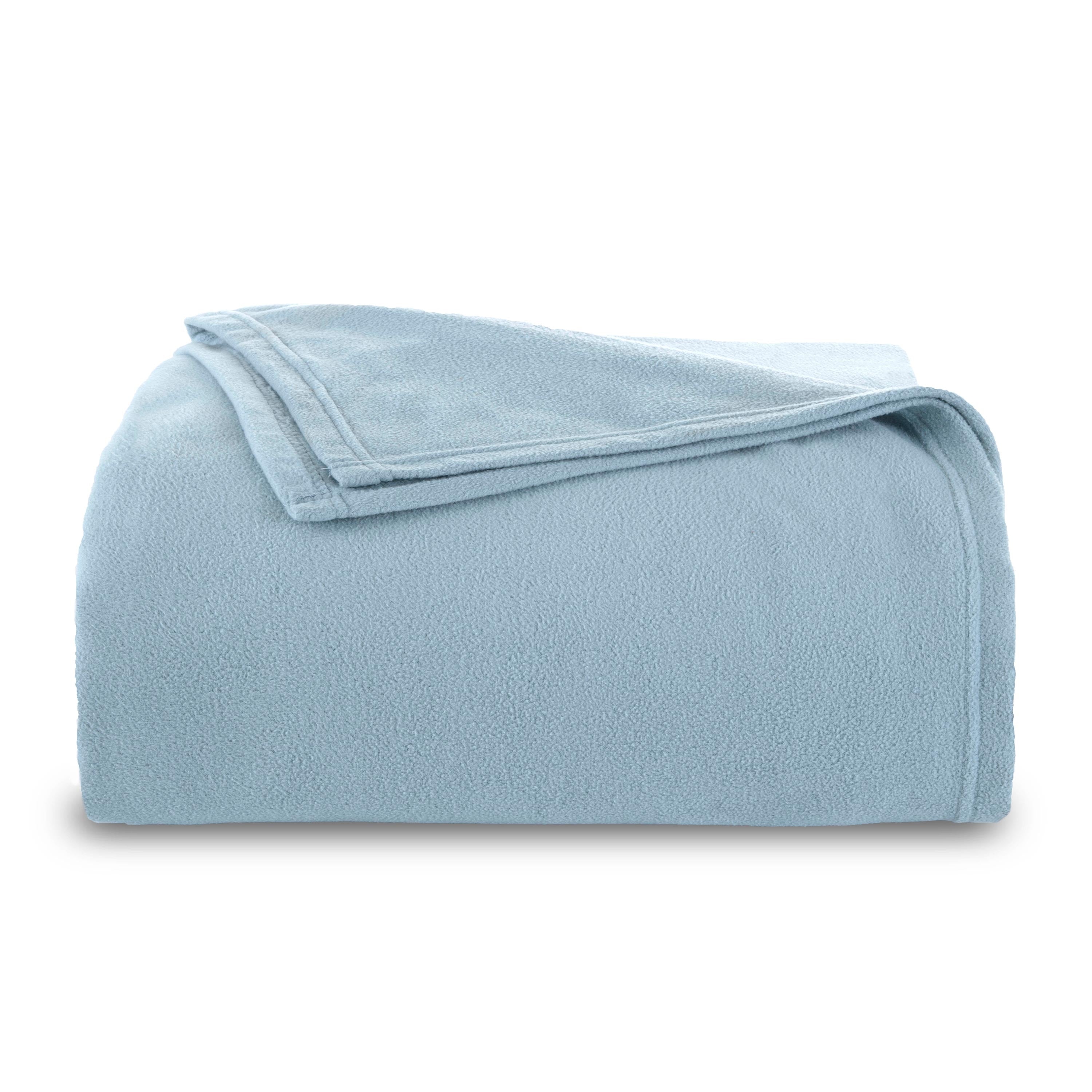 Light blue micro fleece blanket folded neatly with a smooth texture.