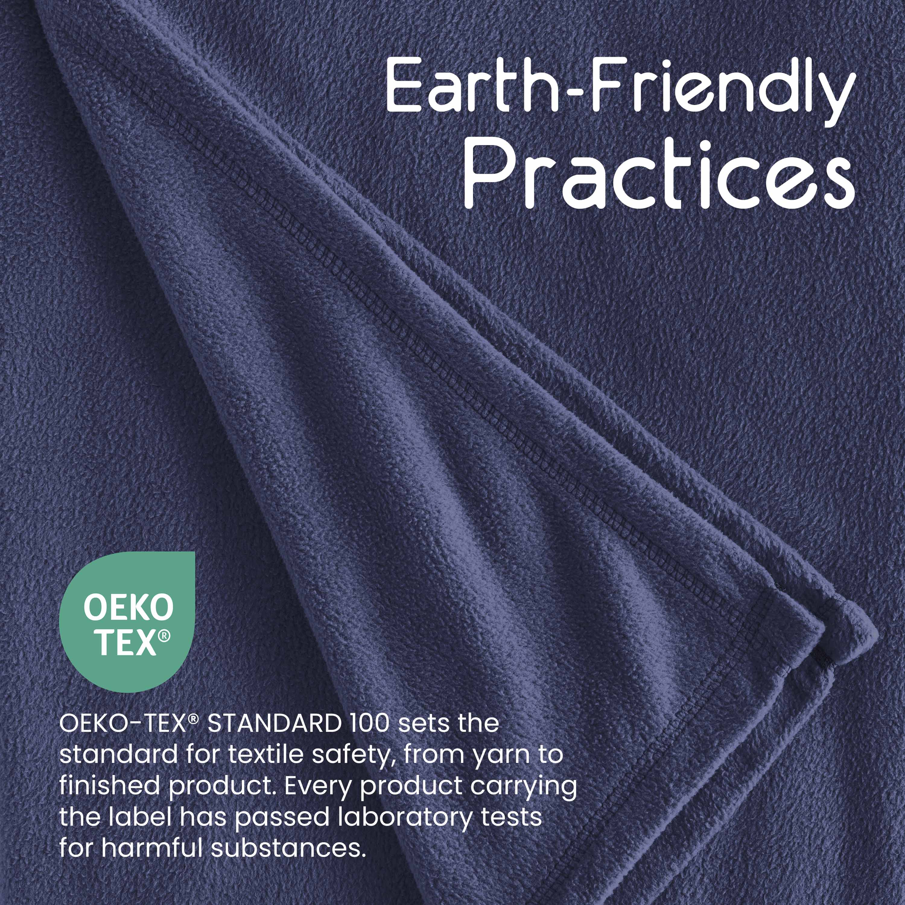 Dark blue micro fleece blanket with a folded edge, featuring Oeko-Tex certification information.