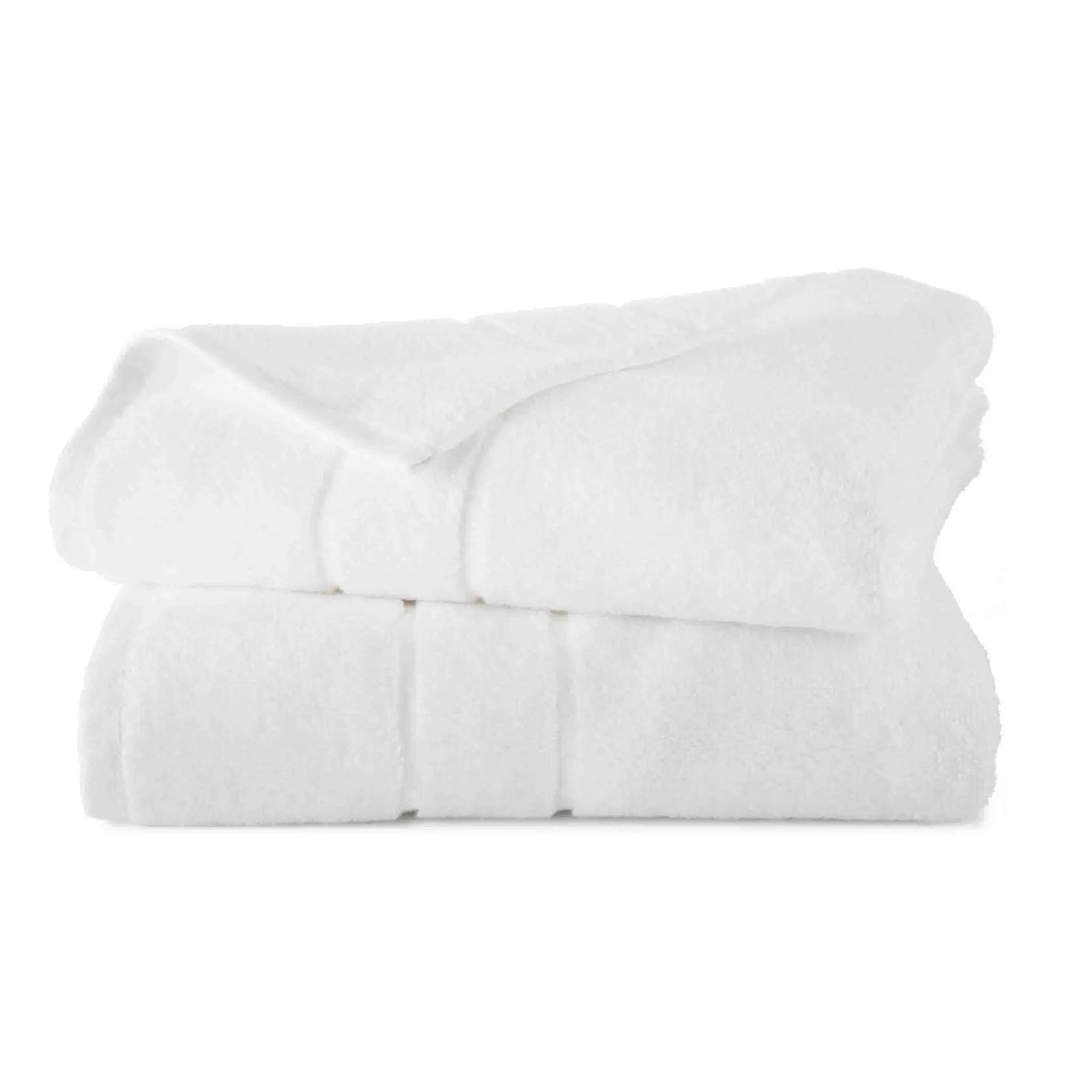Folded white bath towel set on a white background