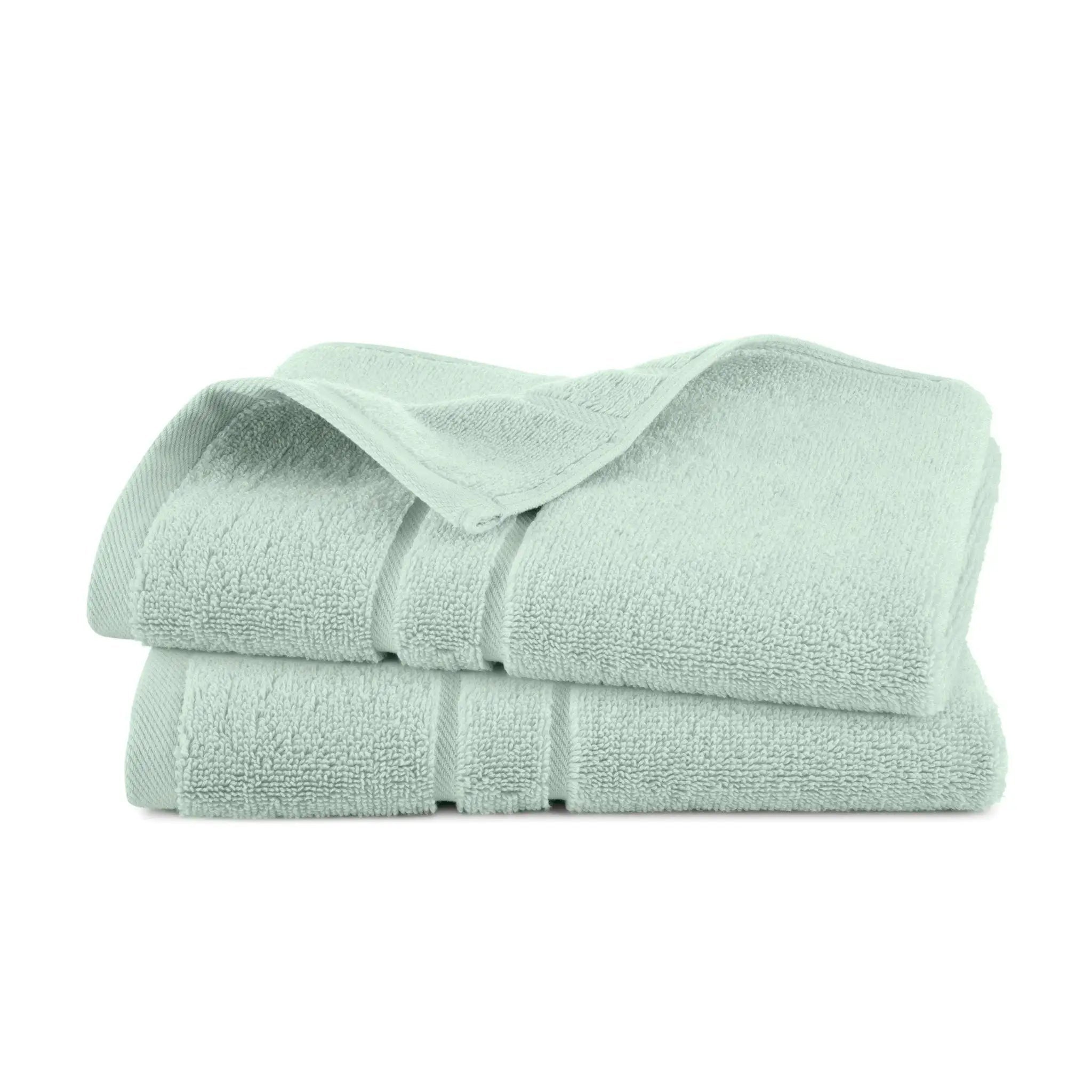 Stack of sage hand towel set on a white background
