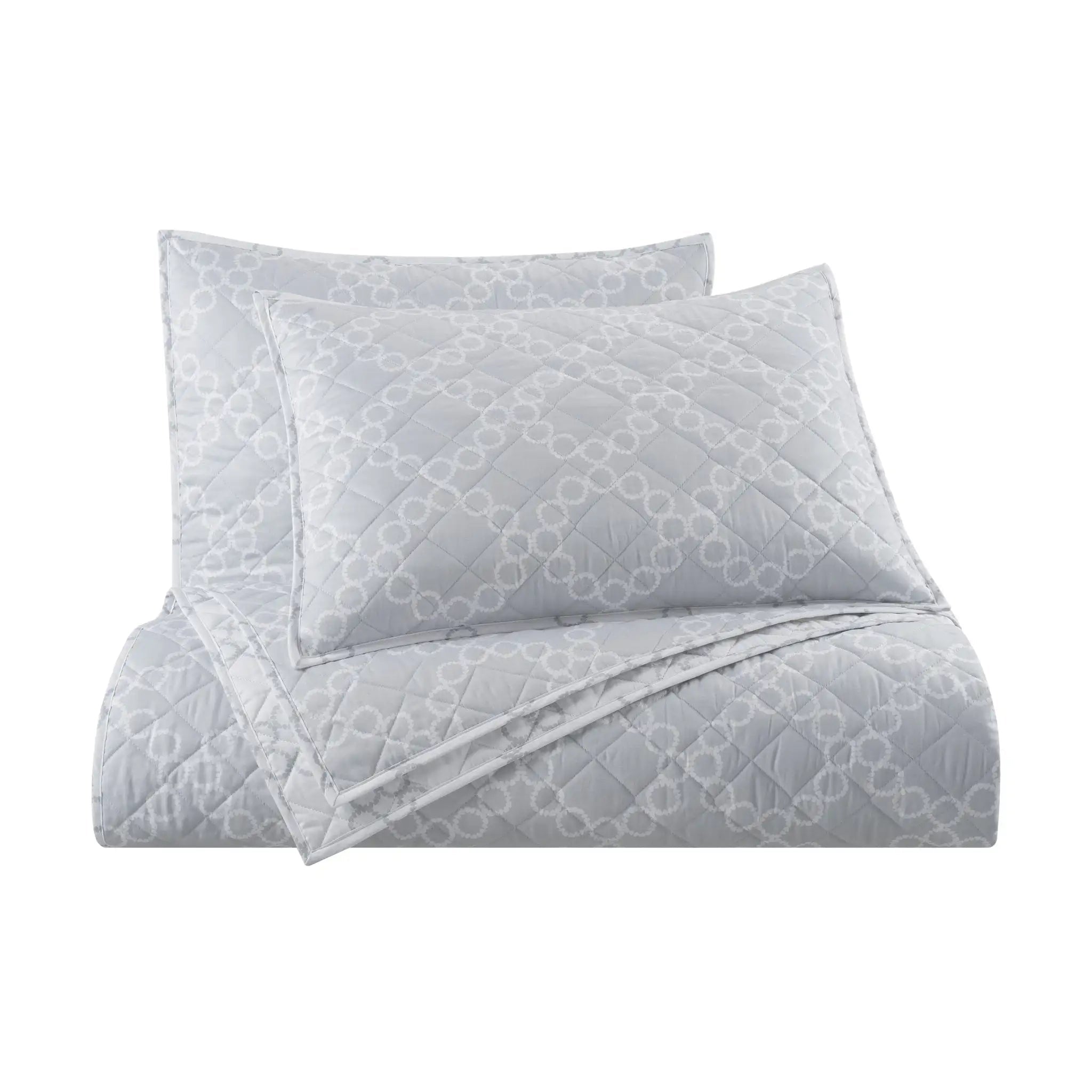 A light gray quilt set featuring a matching comforter and two pillows with an allover tonal geometric chain-link pattern, shown on a solid white background.