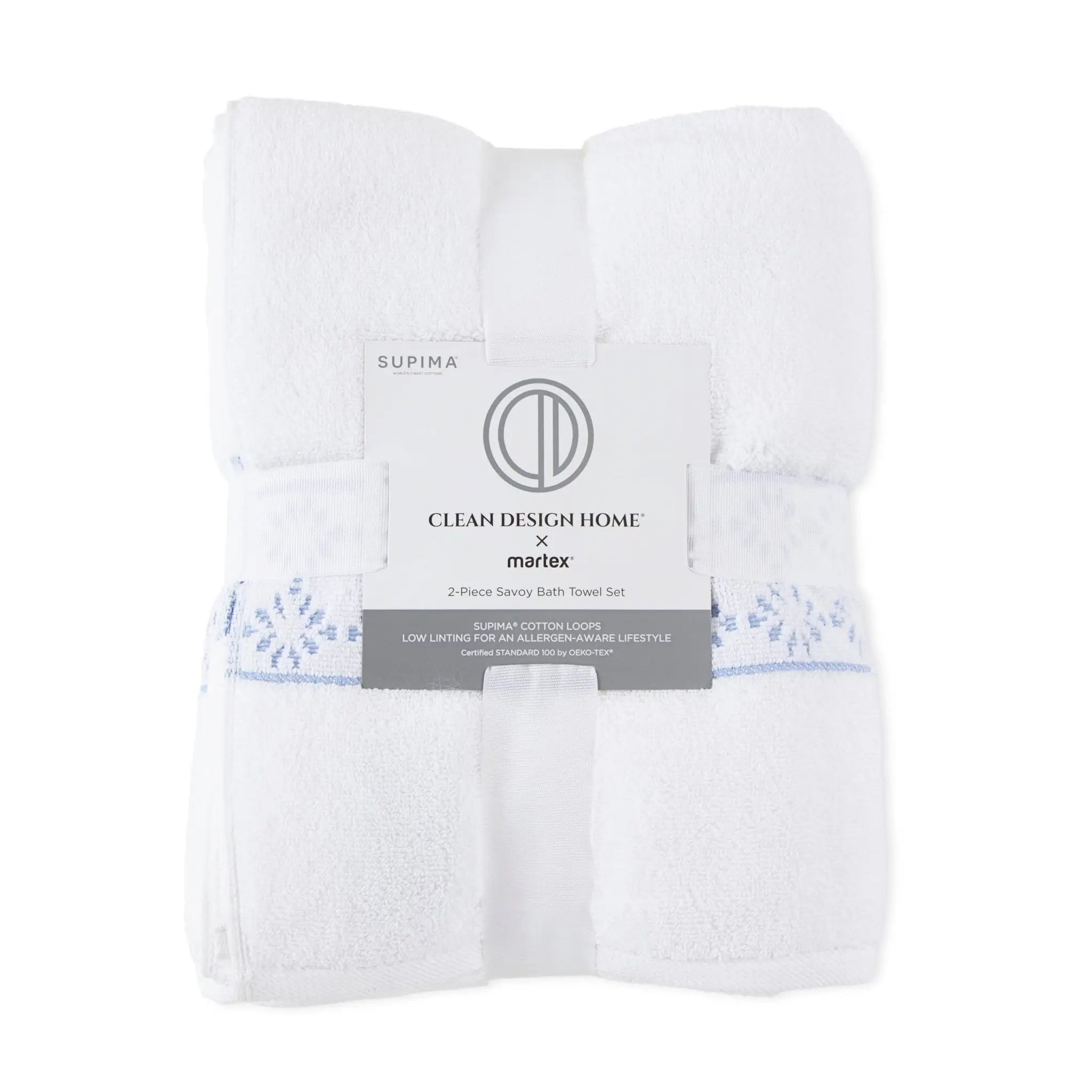 Folded white bath towels with a light blue embroidered pattern, wrapped in a paper band that reads 'SUPIMA' and 'CLEAN DESIGN HOME x marlex'.