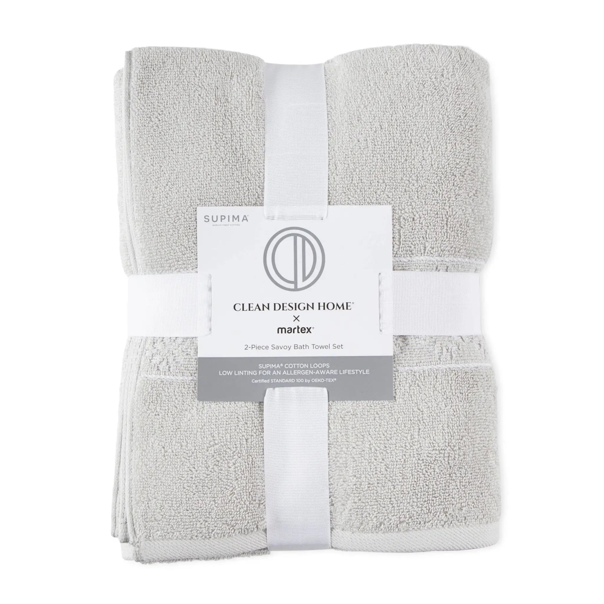 A folded 2-piece bath towel set in light gray terry cloth, wrapped with a white ribbon and a paper label from Clean Design Home x martex.