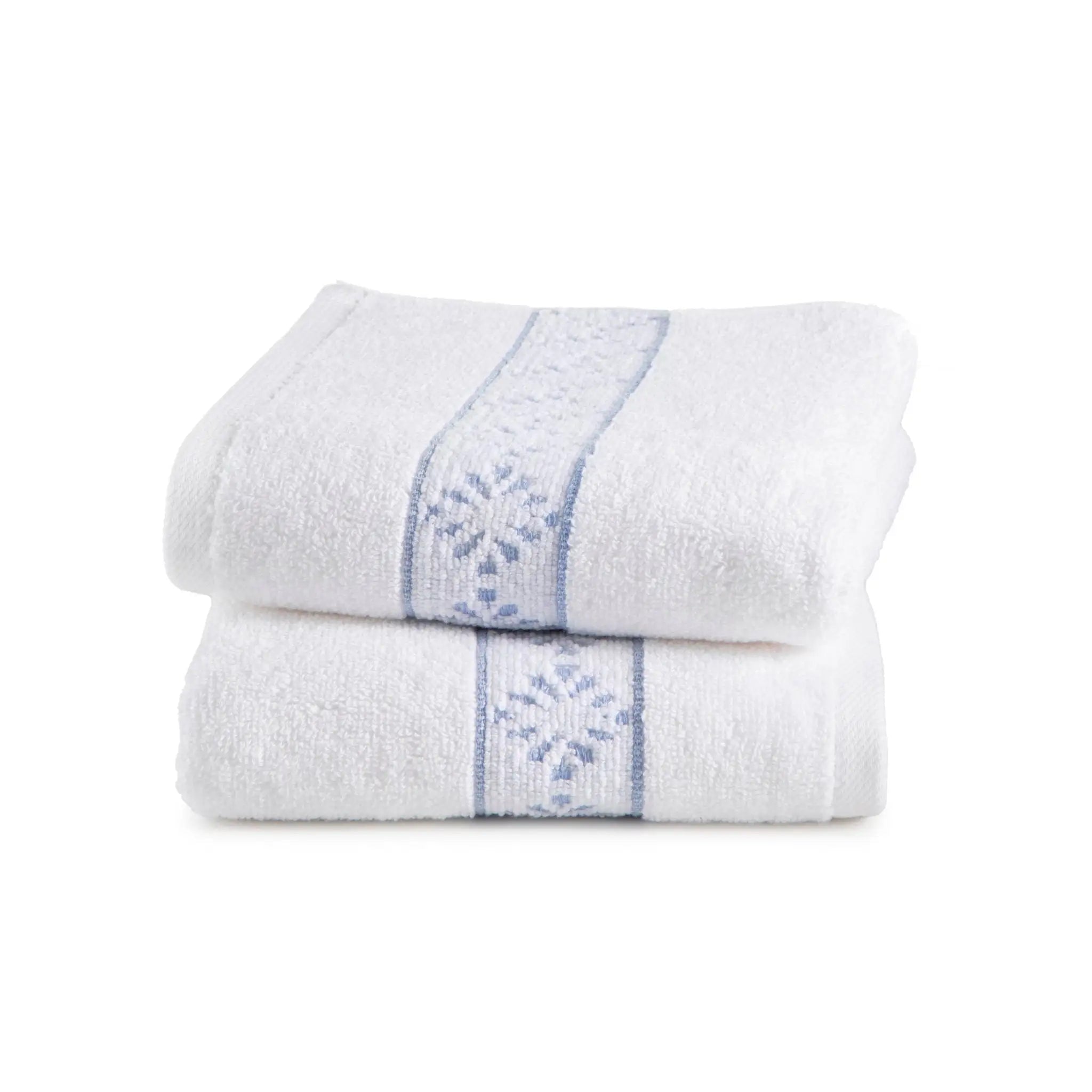 Two white hand towels with blue embroidery on a white background