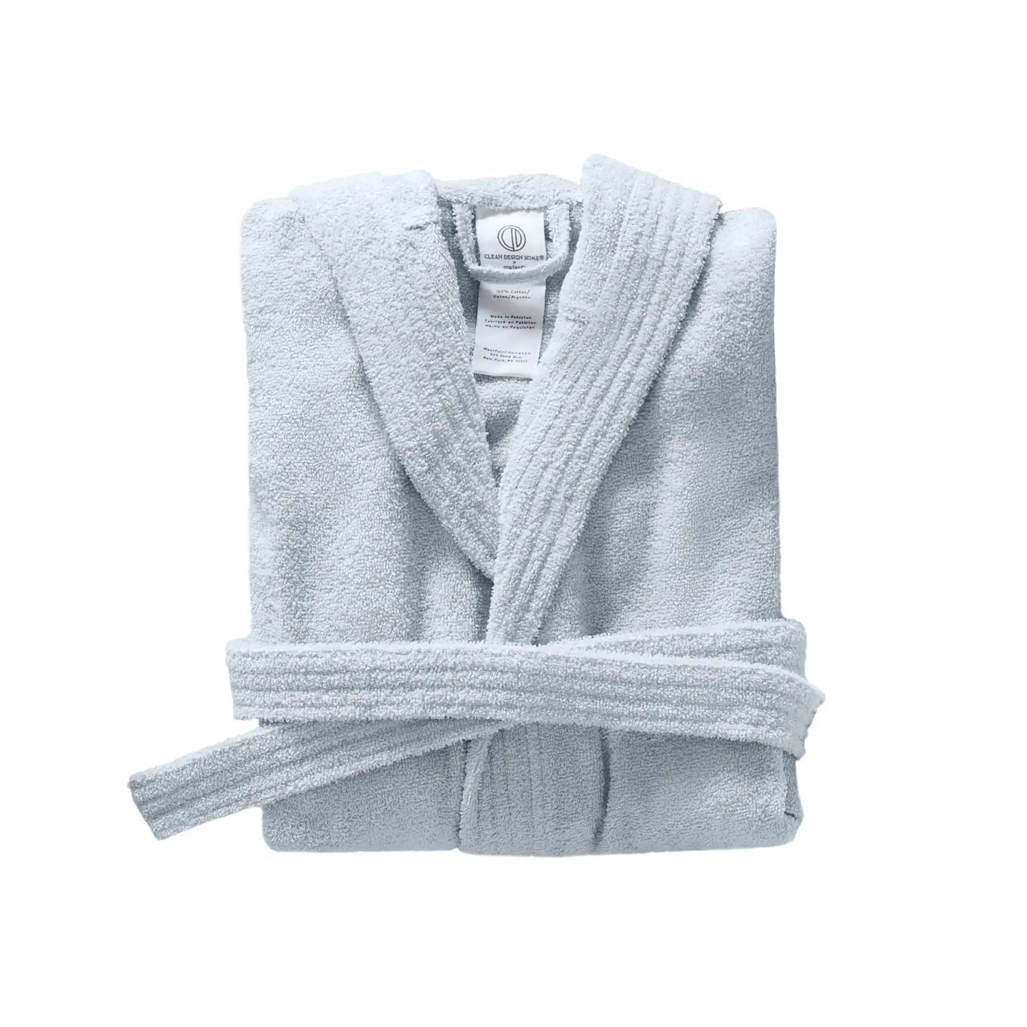 Folded blue bathrobe on a white background
