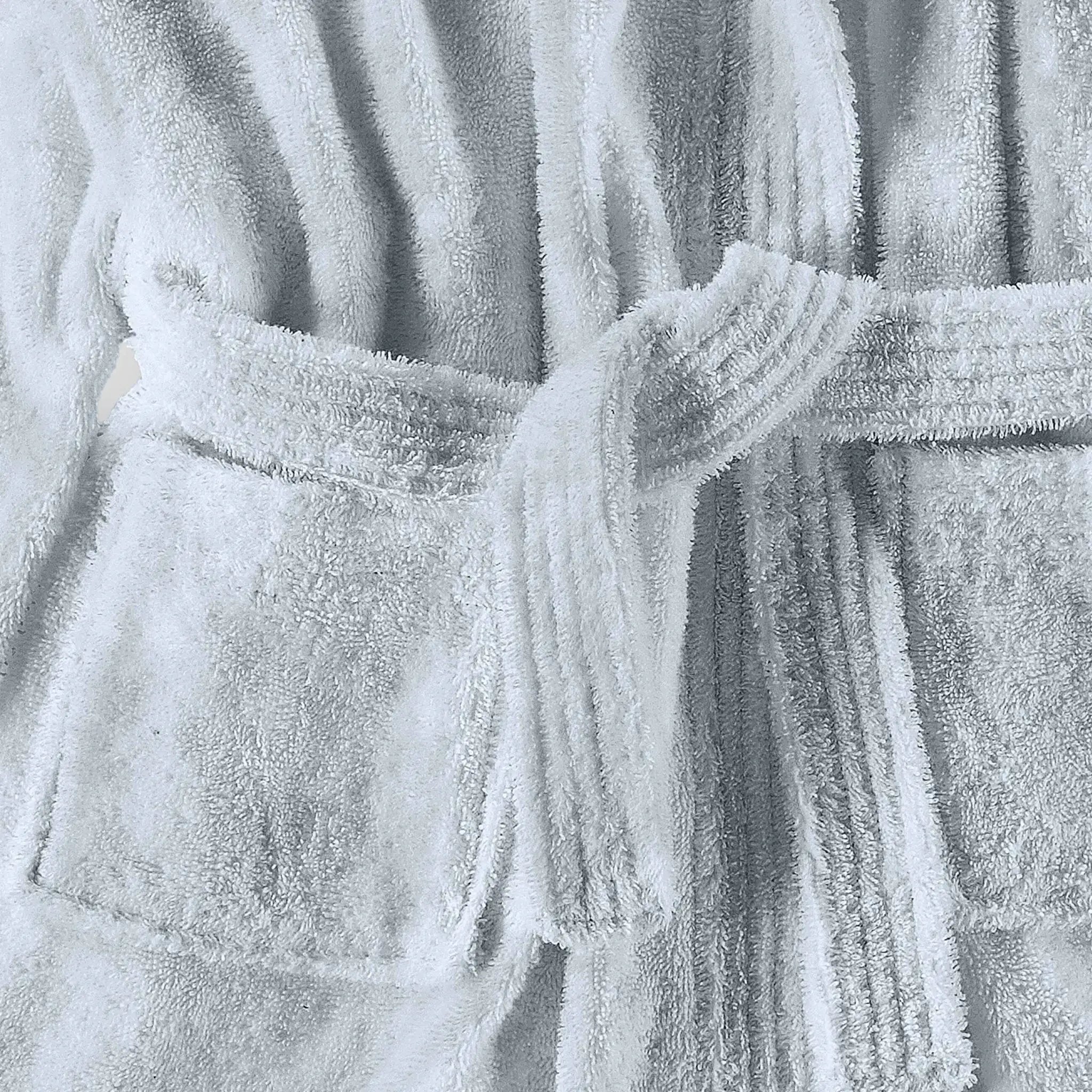 Close-up of a textured blue bathrobe with a belt