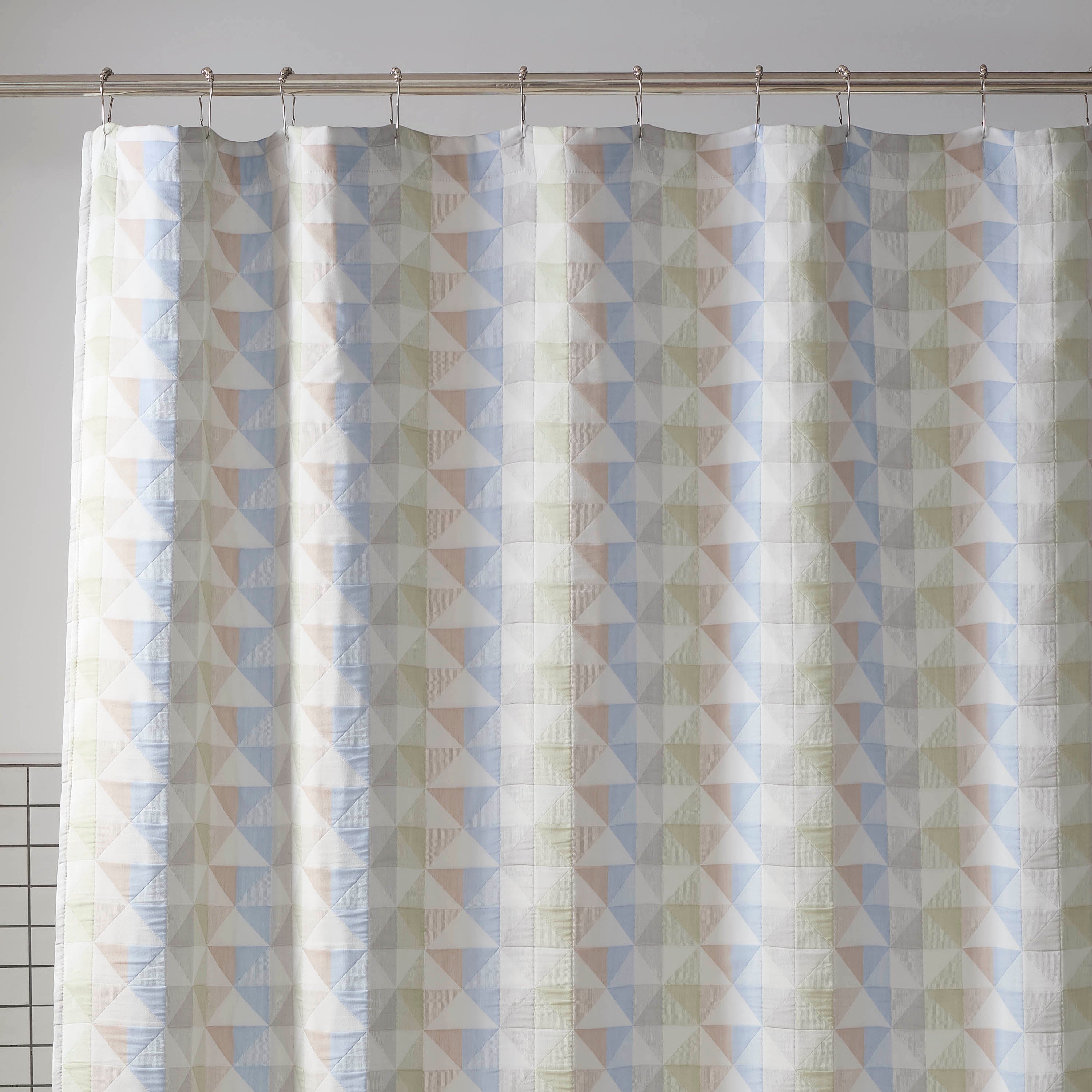 Shower curtain featuring a geometric pattern in pastel colors, measuring 72x72 inches.
