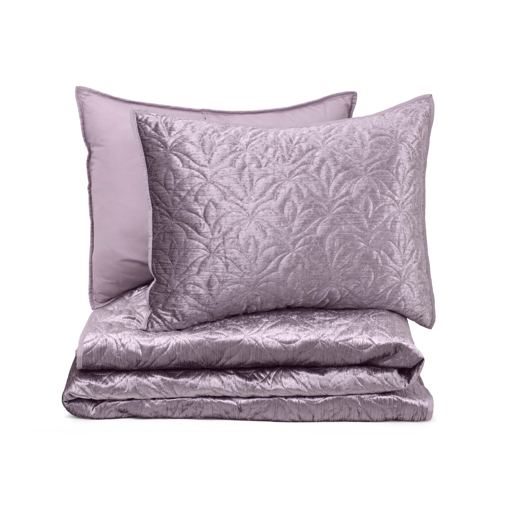 Purple textured quilt set on a white background