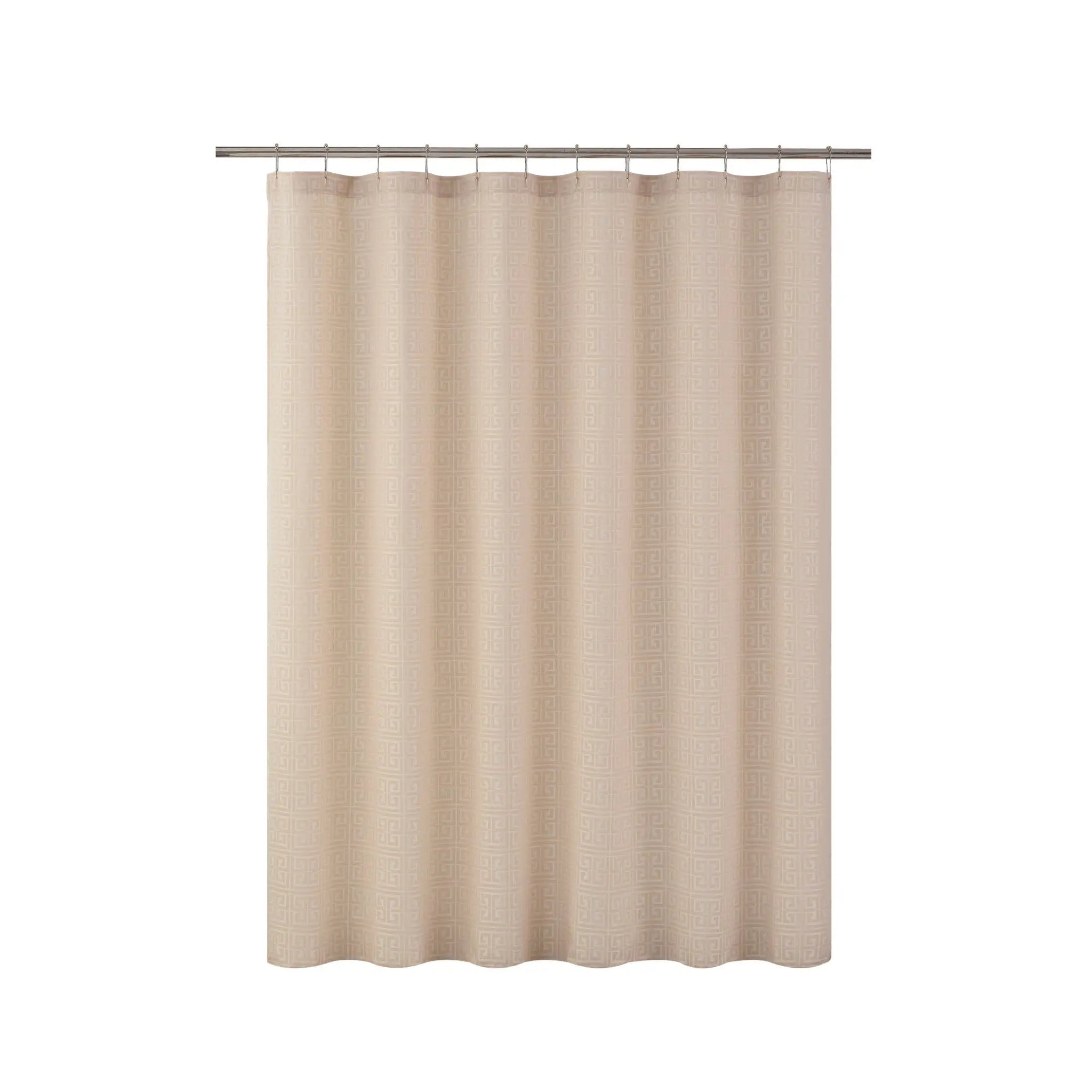 Beige shower curtain with a metal rod on a white background