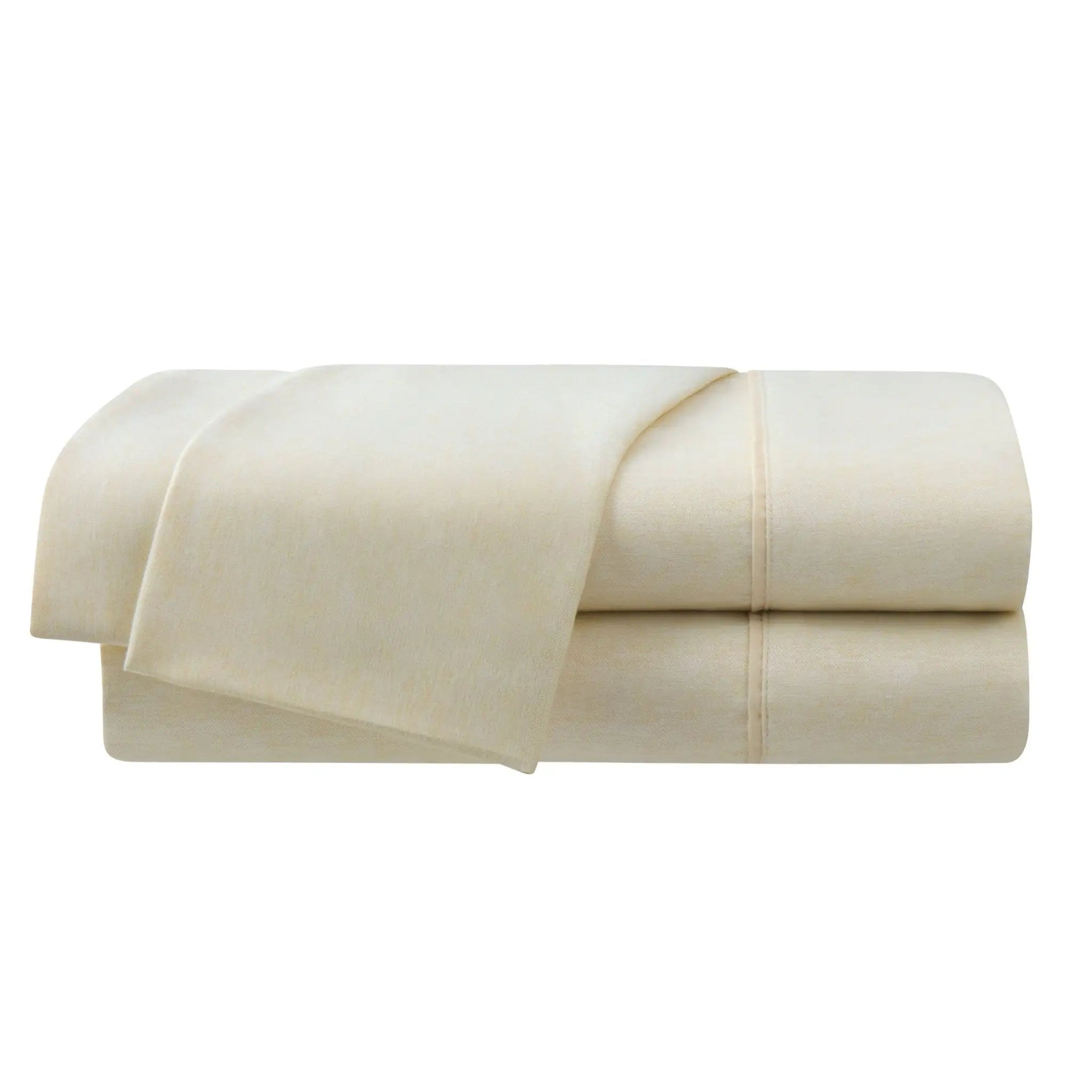 Folded beige bed sheets on a white background
