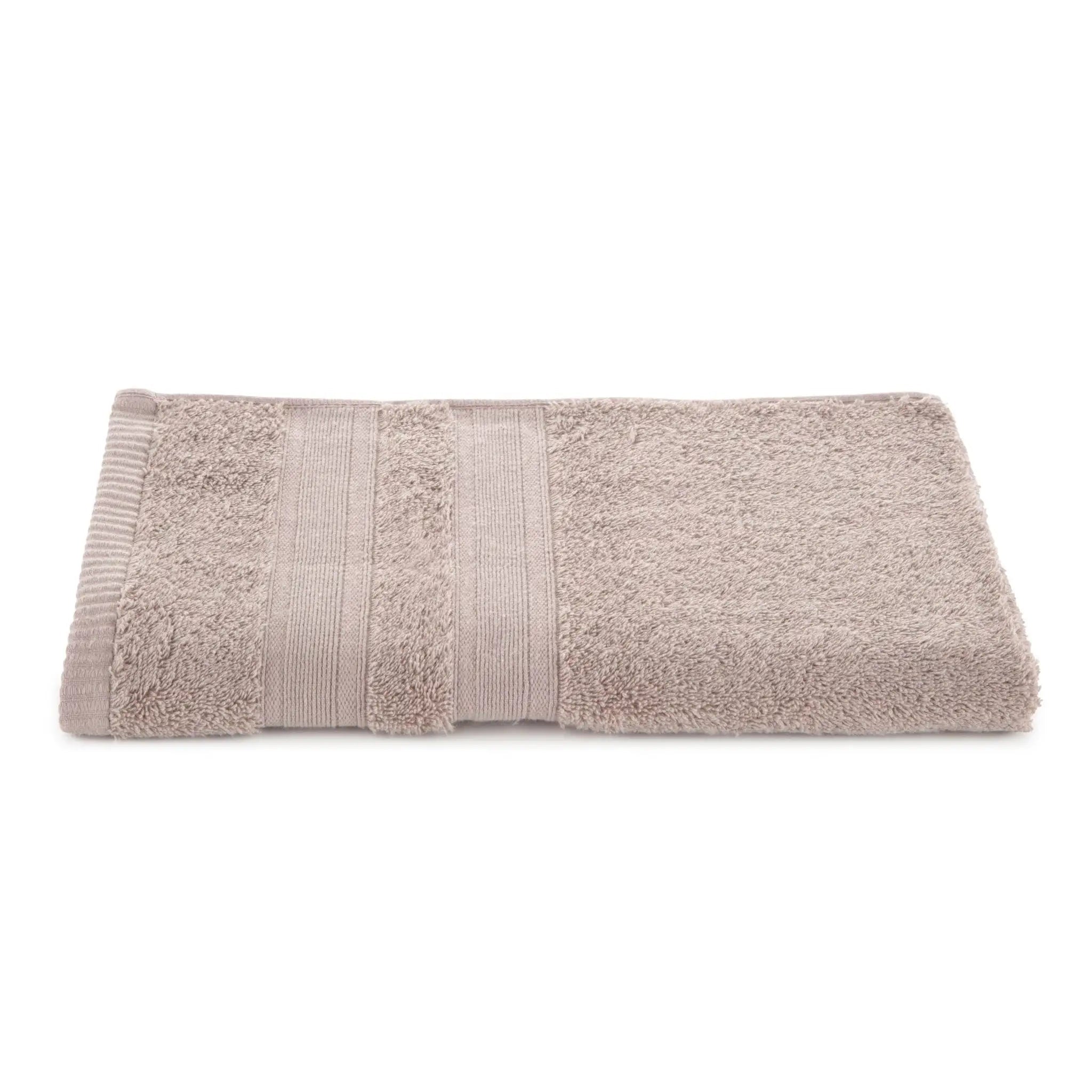 Folded sand towel with textured stripes on a white background