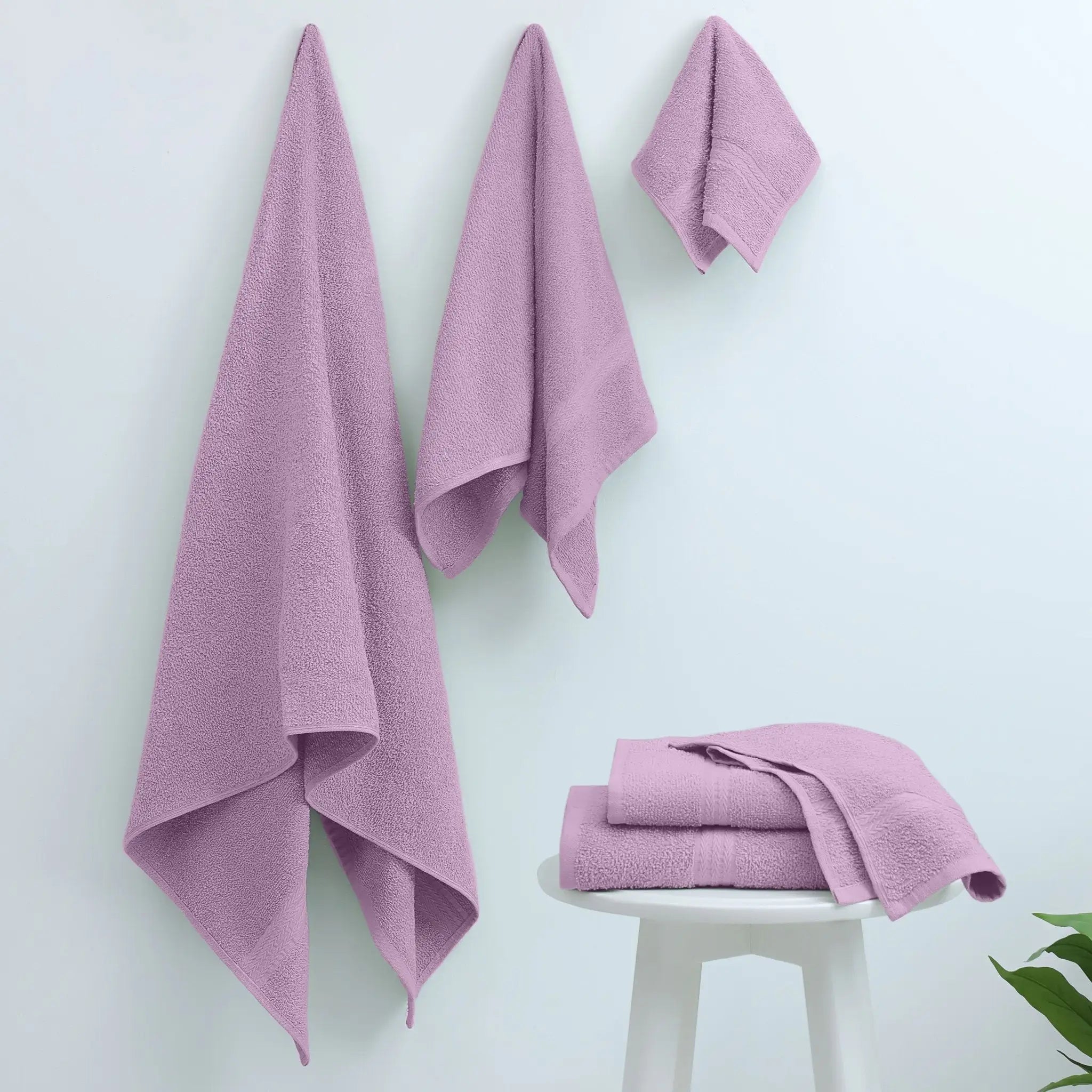 Set of lilac towels on a white background