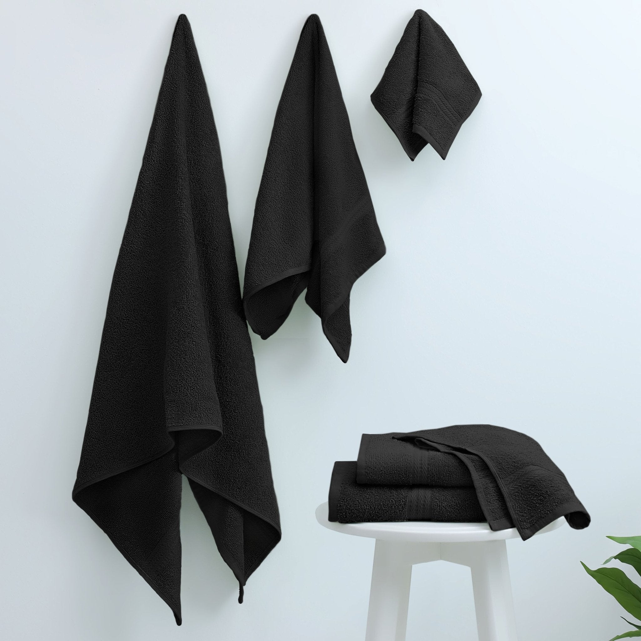 Set of black towels on a white background