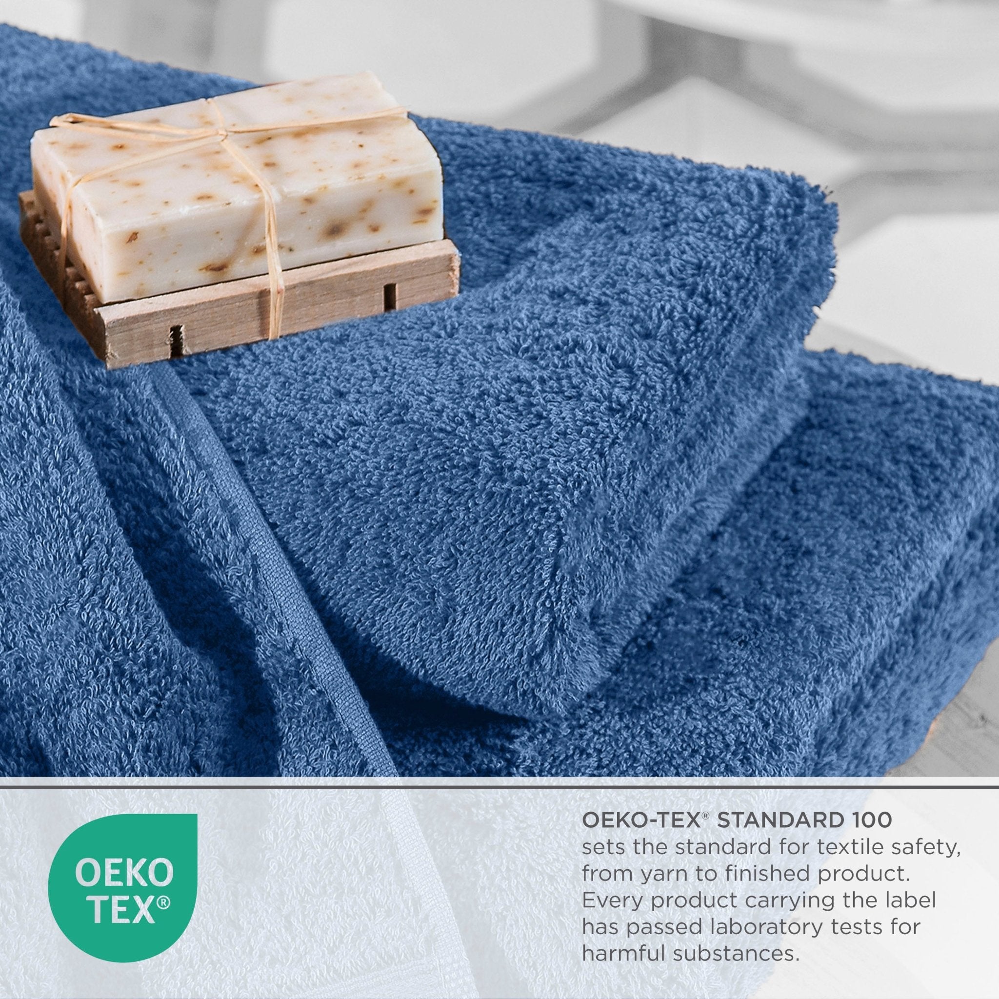 Blue towel with soap on a wooden dish, featuring OEKO-TEX certification.