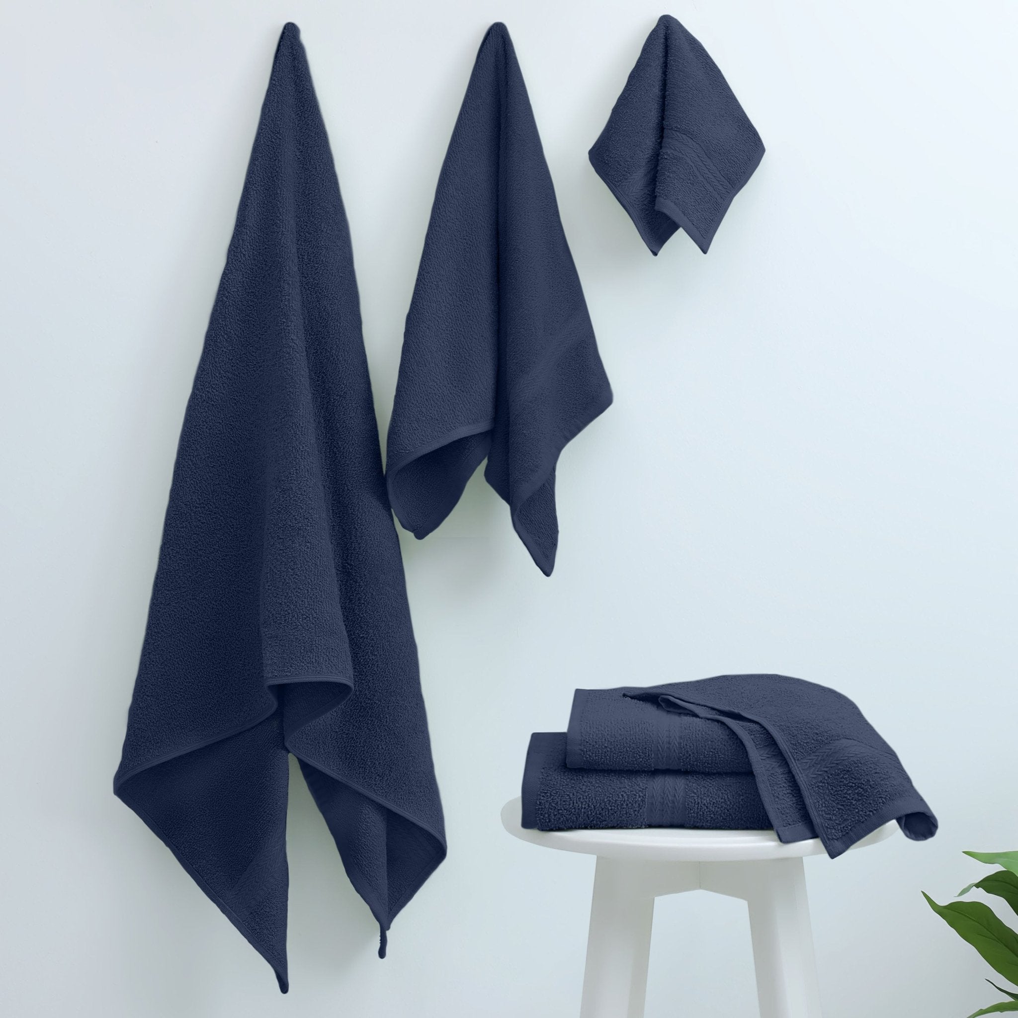 Set of navy blue towels on a white background