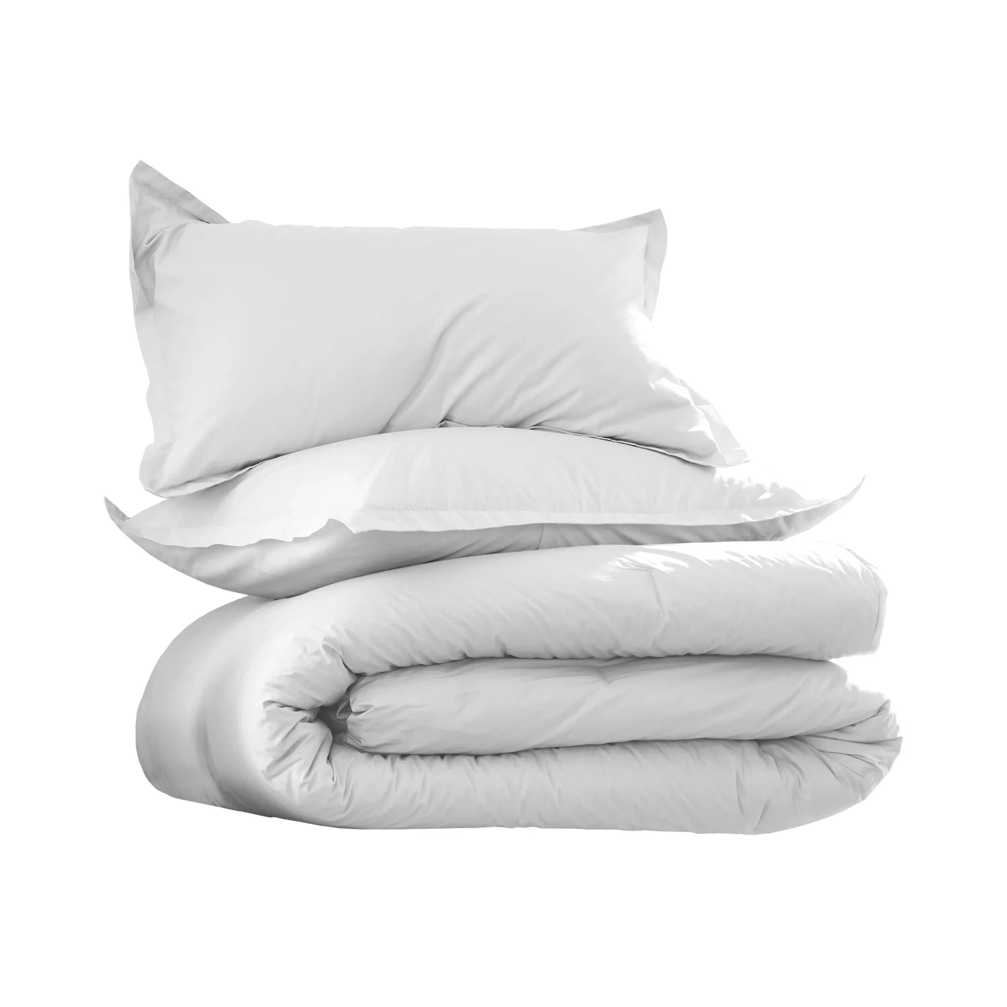 A neatly stacked bedding set on a plain white background, featuring a folded white comforter with two matching white pillowcases behind it.