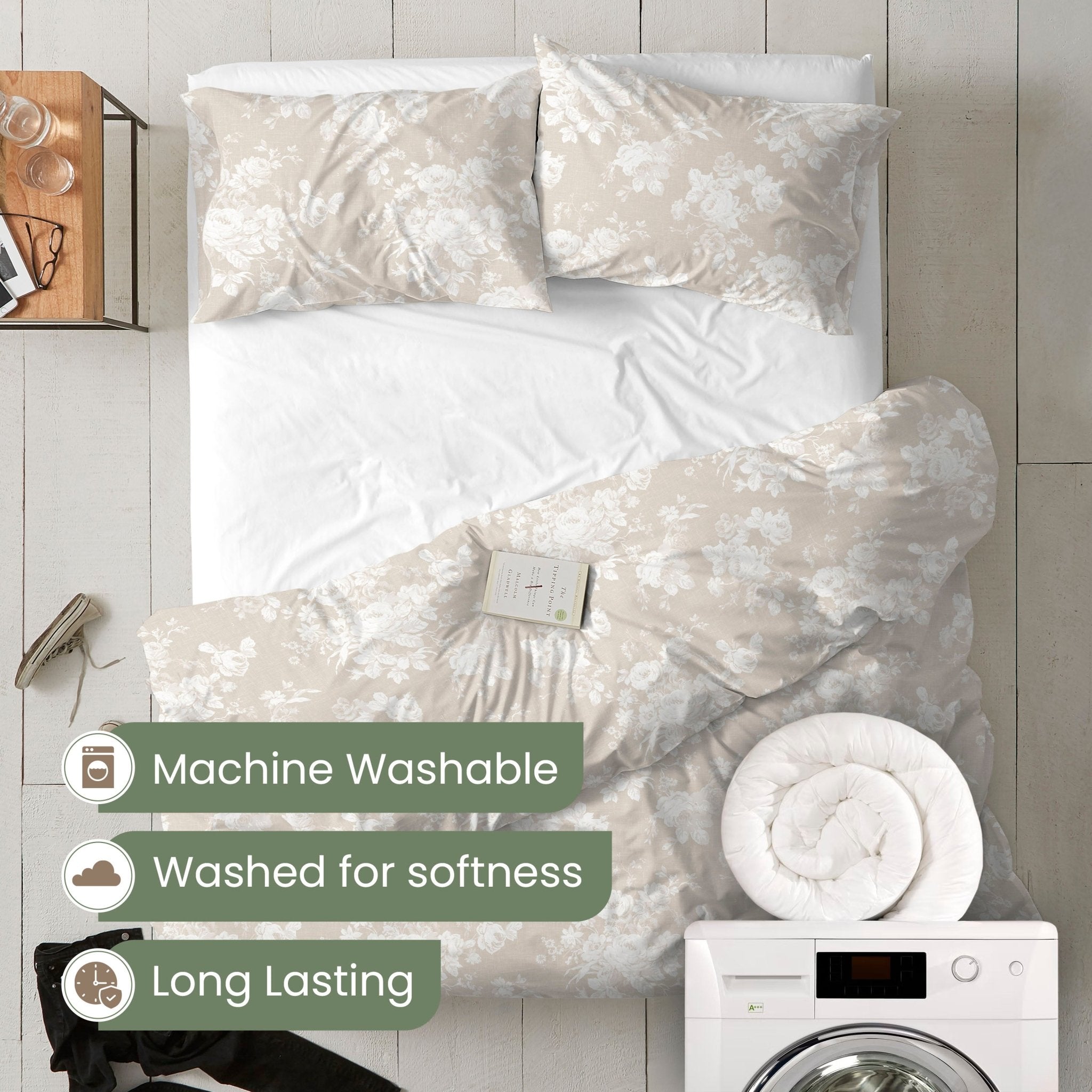 Floral comforter set on a bed with washing machine and dryer in the background