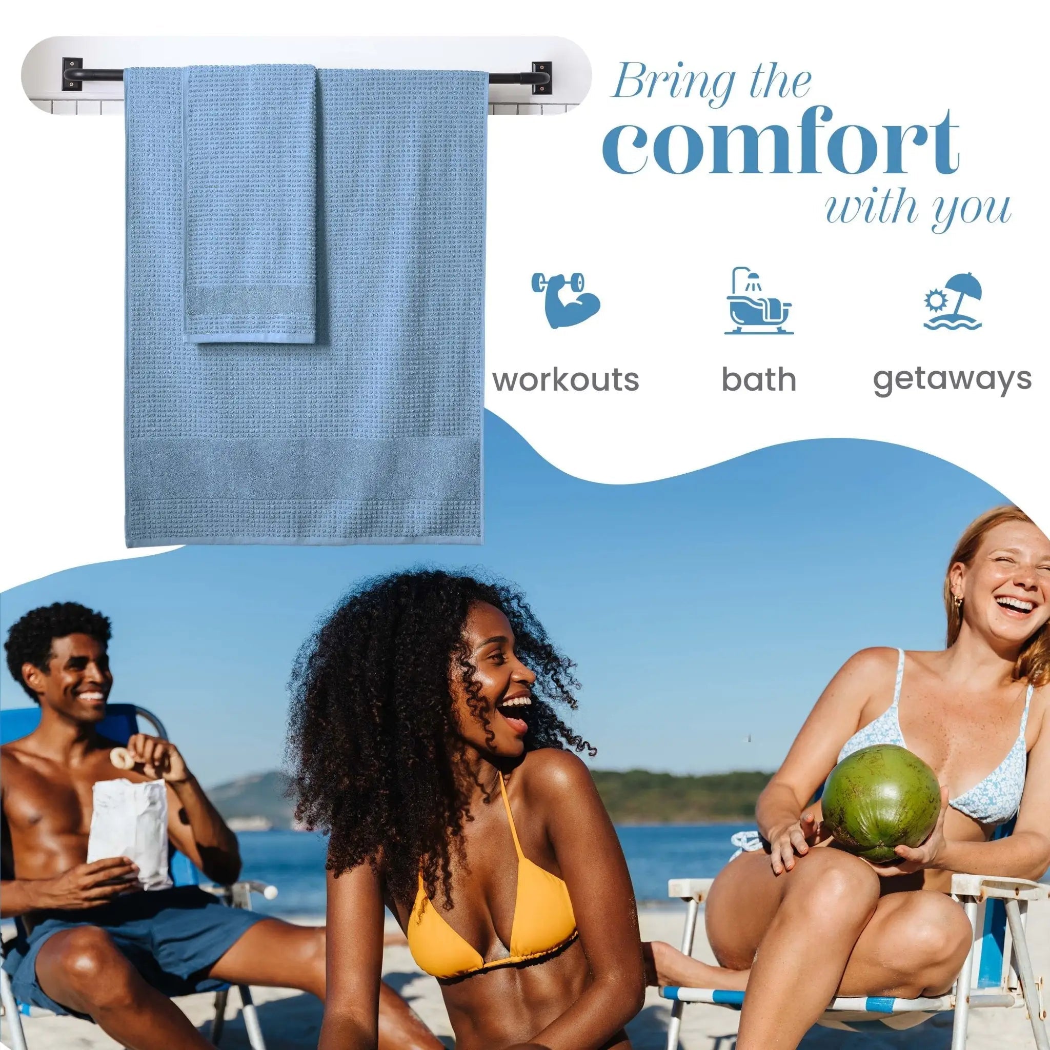 Blue towel hanging on a rack with people enjoying the beach in the background