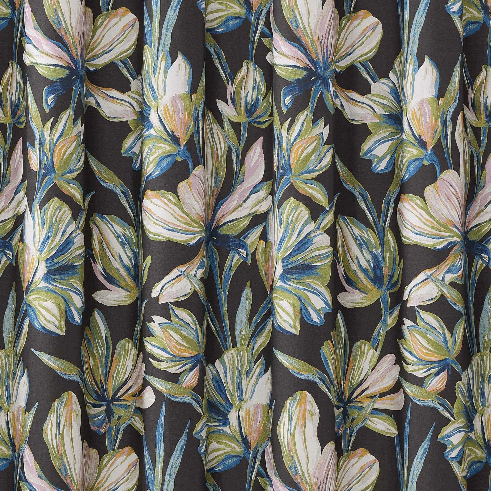 A close-up of a dark charcoal gray curtain or fabric panel featuring a watercolor-style floral print with cream, light blue, and soft yellow flowers and leaves.