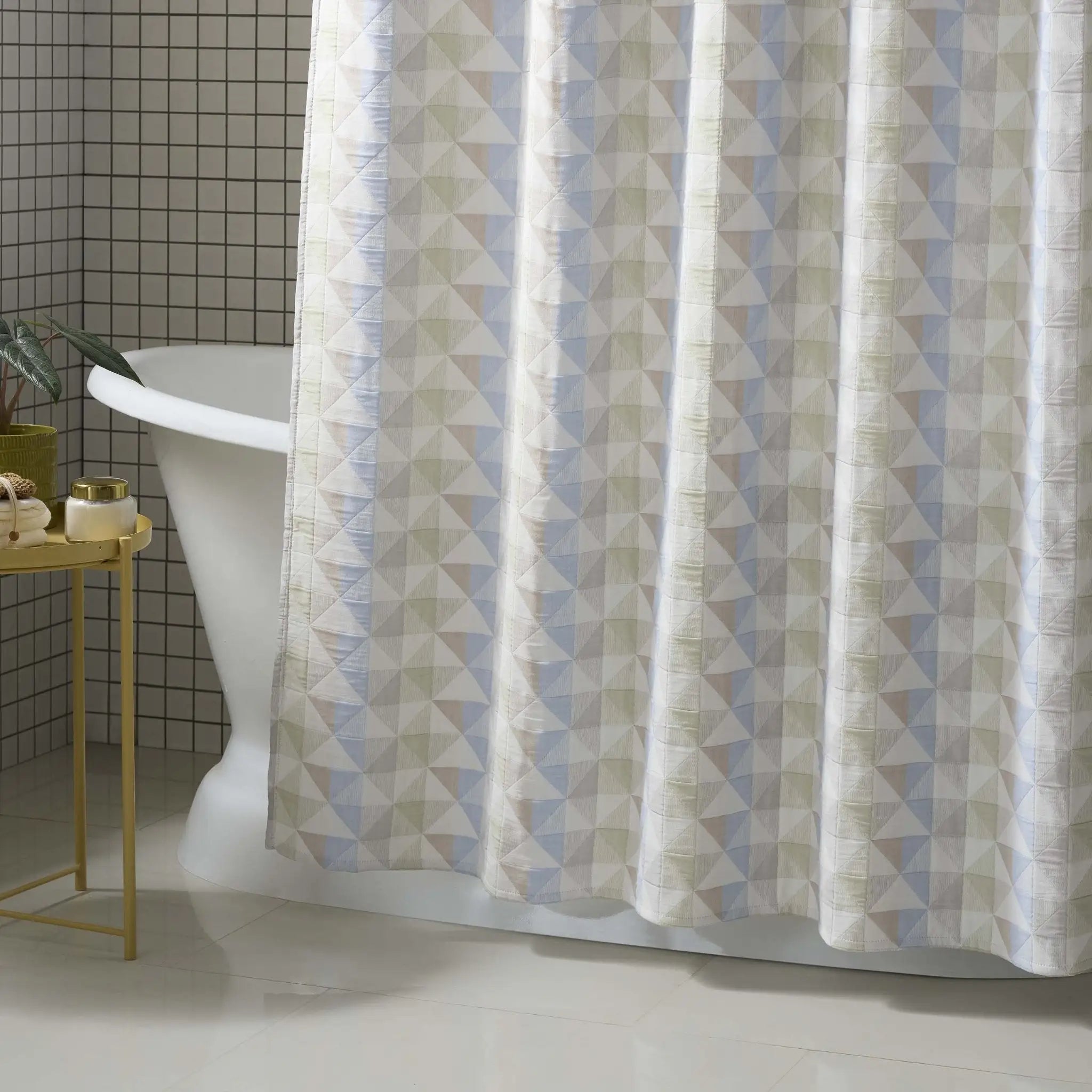 Shower curtain with geometric pattern in a bathroom setting