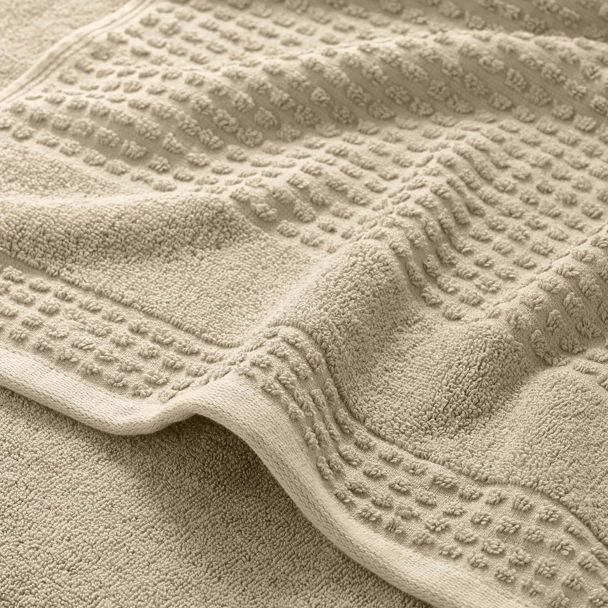 Close-up of a textured sand color bath towel