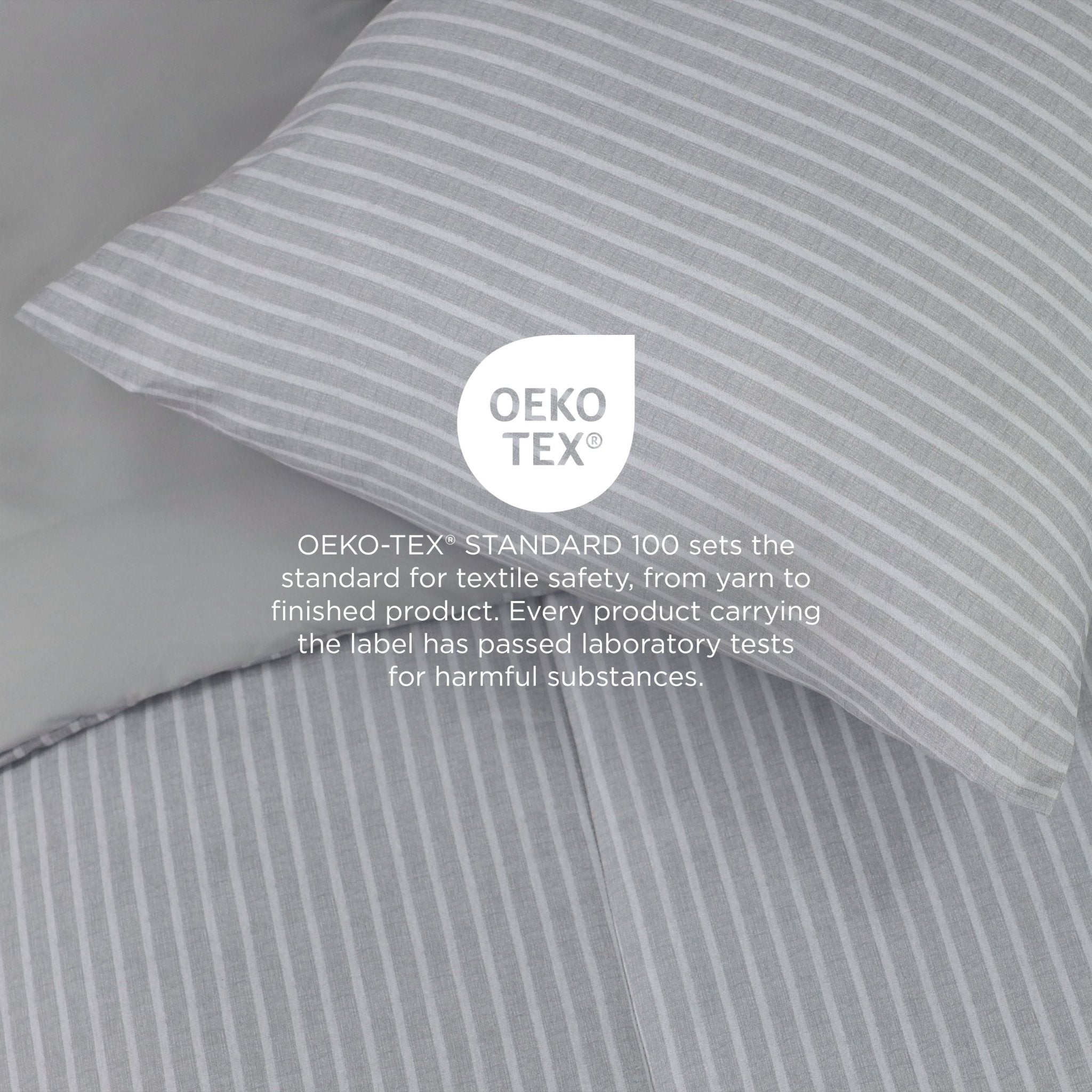 Gray striped fabric with OEKO-TEX label on a gray background